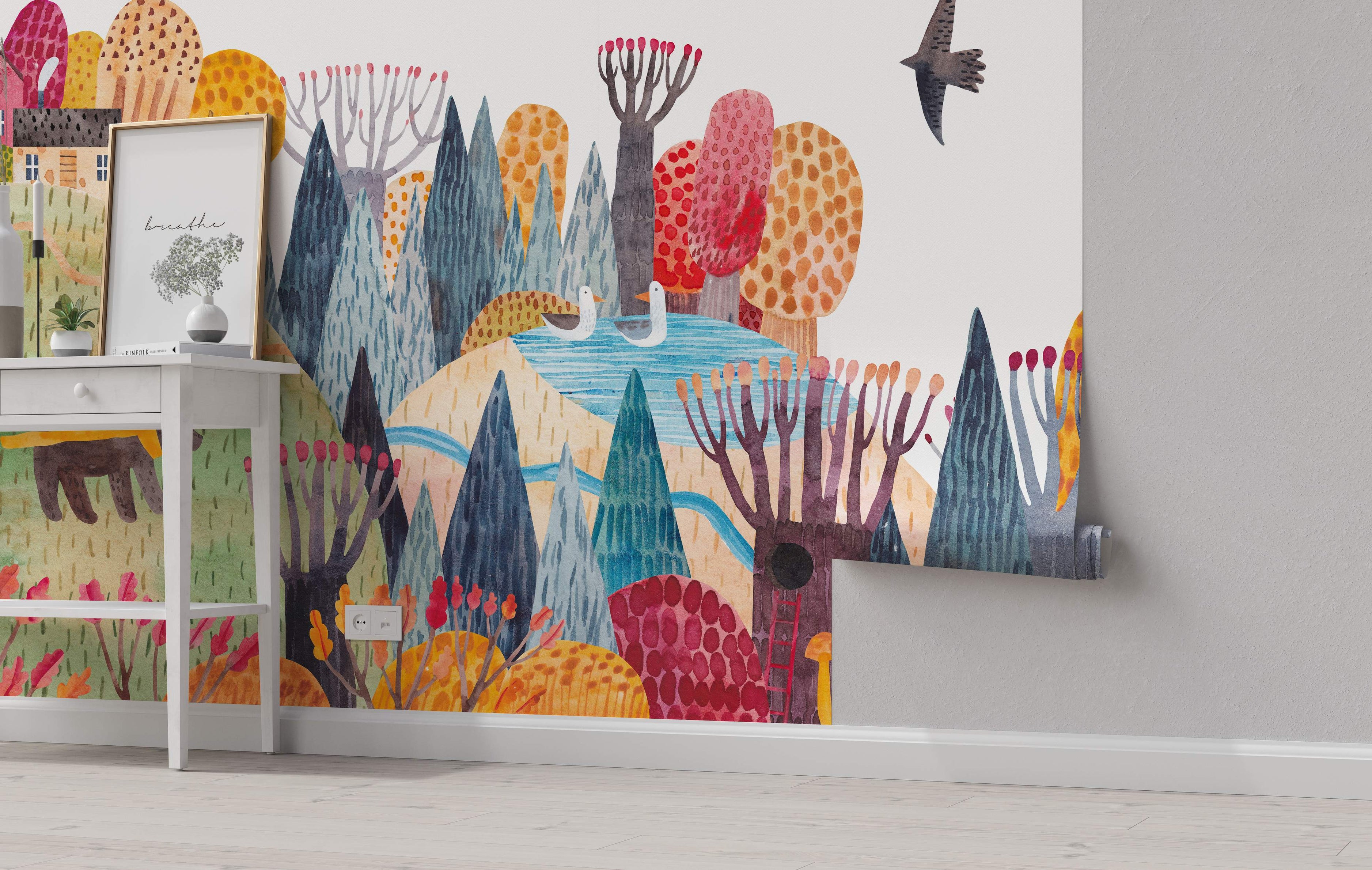 Whimsical watercolor mural featuring a stylized forest landscape with colorful trees, rolling hills, a blue river, and birds.