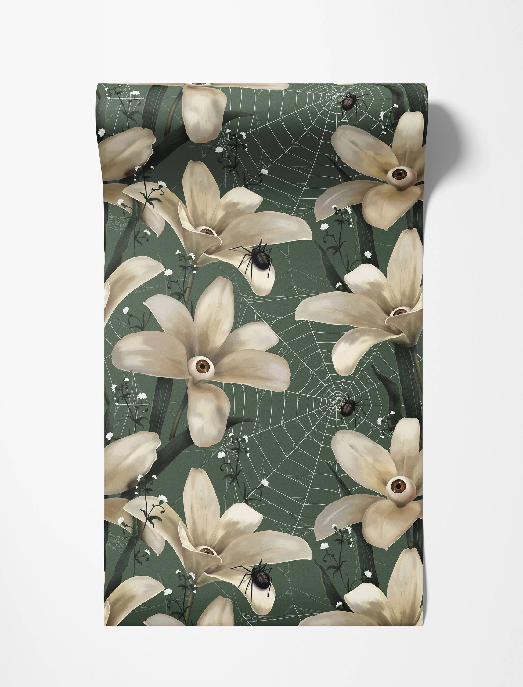 Surreal wallpaper with off-white flowers with eyeballs, black spiders, and webs on a dark green background.