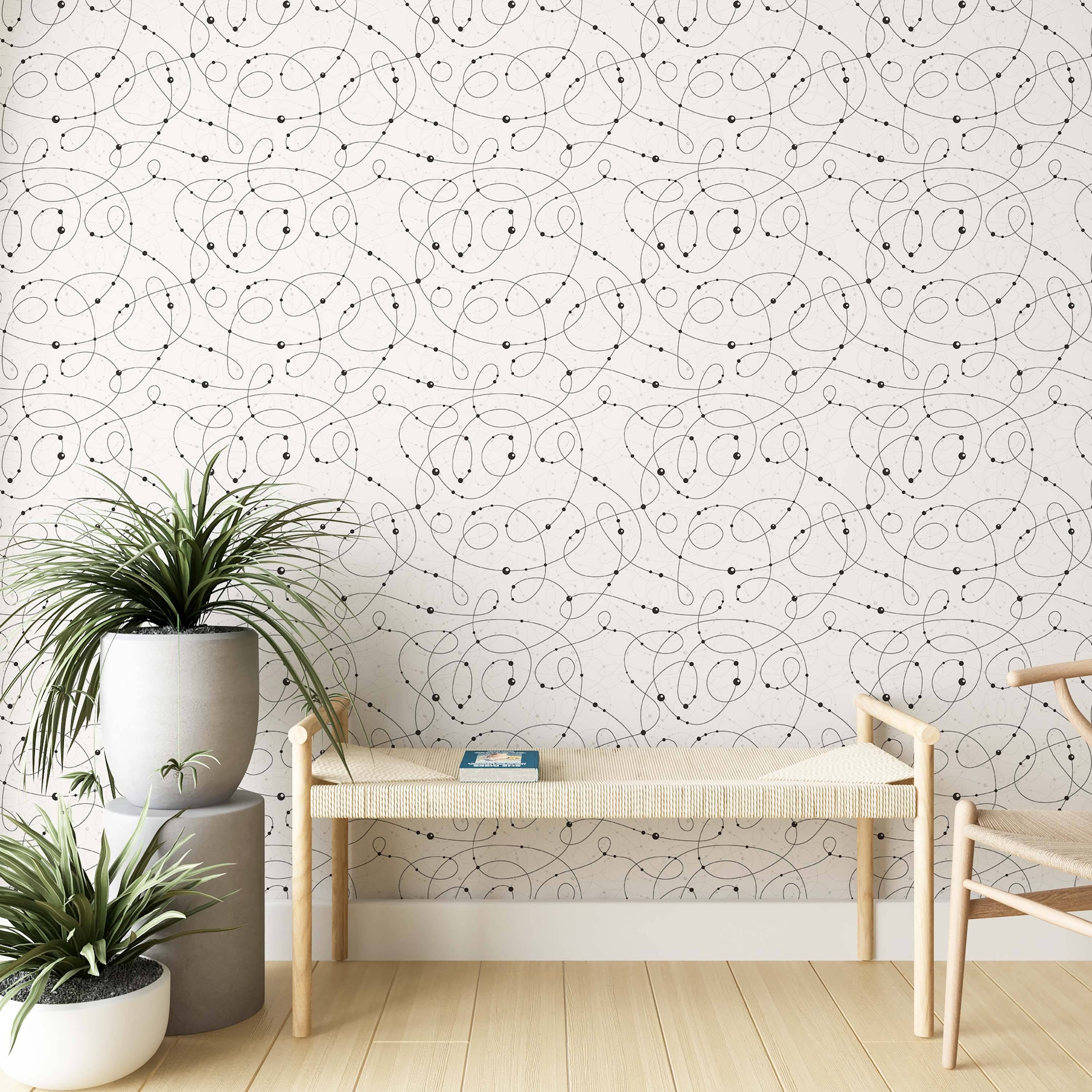 Wallpaper with intersecting black swirling lines and dots, accented by faint thin lines, on an off-white background.