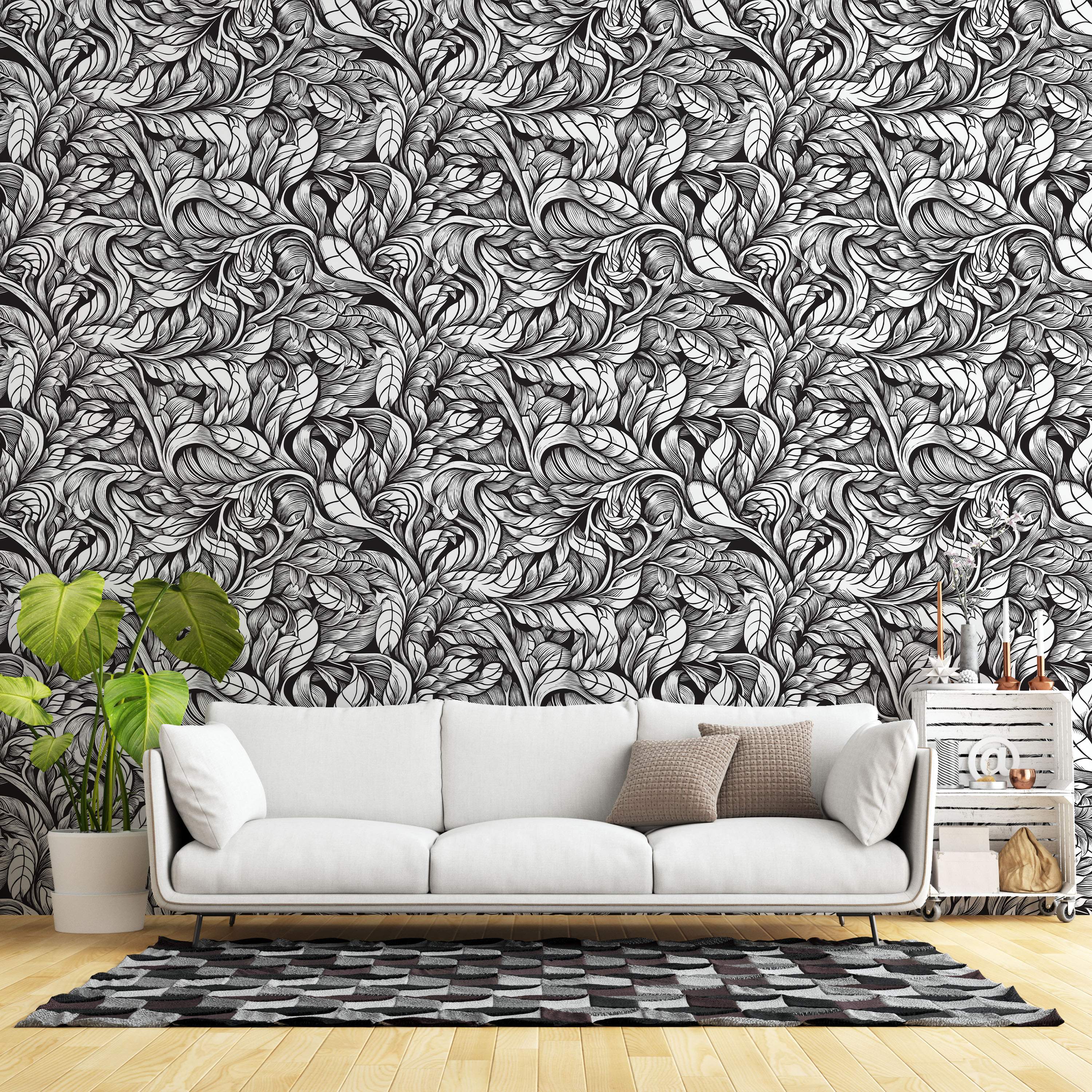 Intricate black and white wallpaper with a dense pattern of swirling, hand-drawn style leaves filling the space.