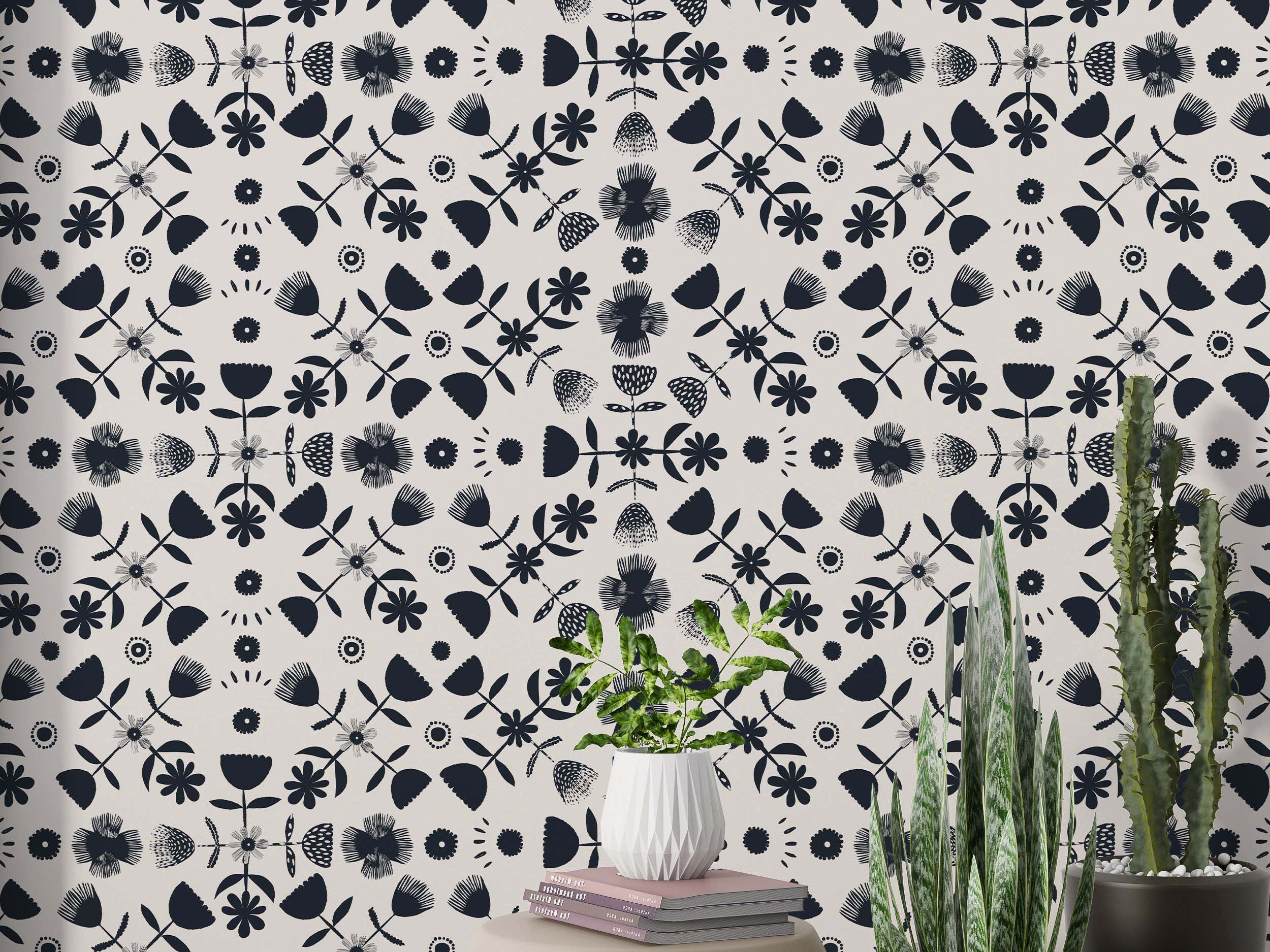 Symmetrical wallpaper featuring stylized dark blue floral and geometric elements in a repeating pattern on a cream background.