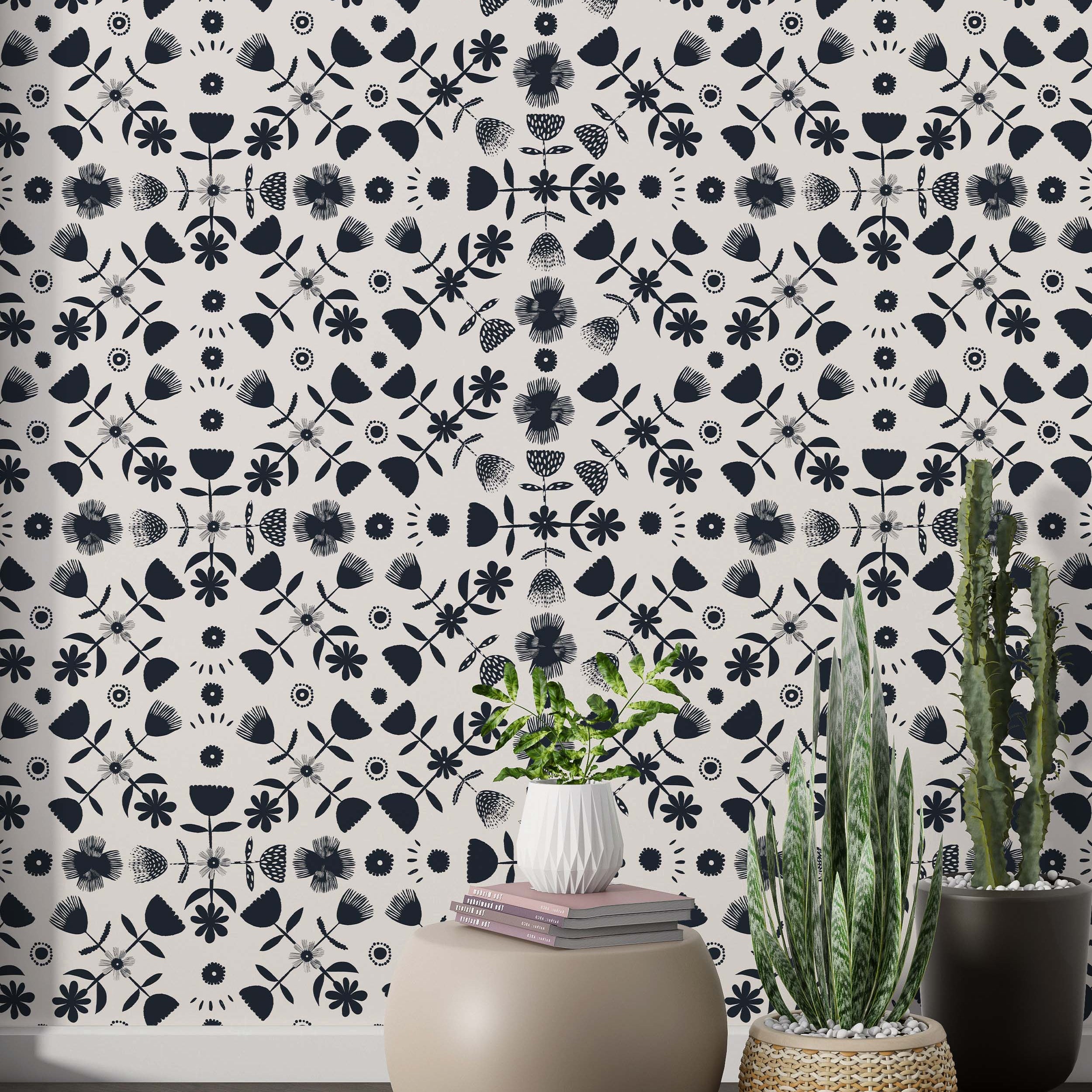Symmetrical wallpaper featuring stylized dark blue floral and geometric elements in a repeating pattern on a cream background.