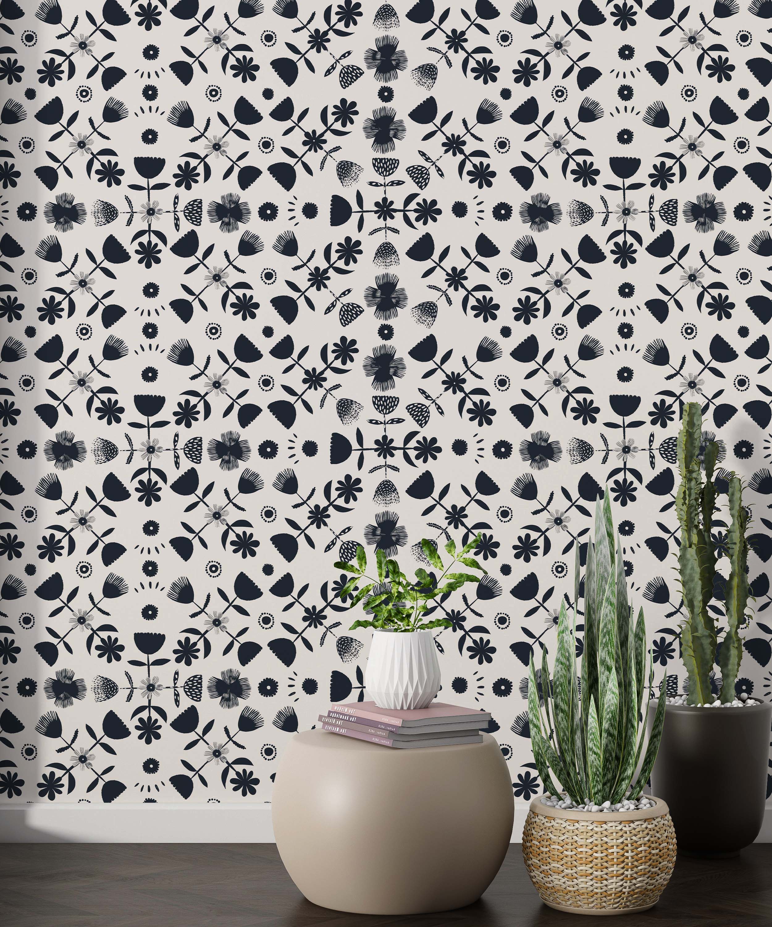 Symmetrical wallpaper featuring stylized dark blue floral and geometric elements in a repeating pattern on a cream background.