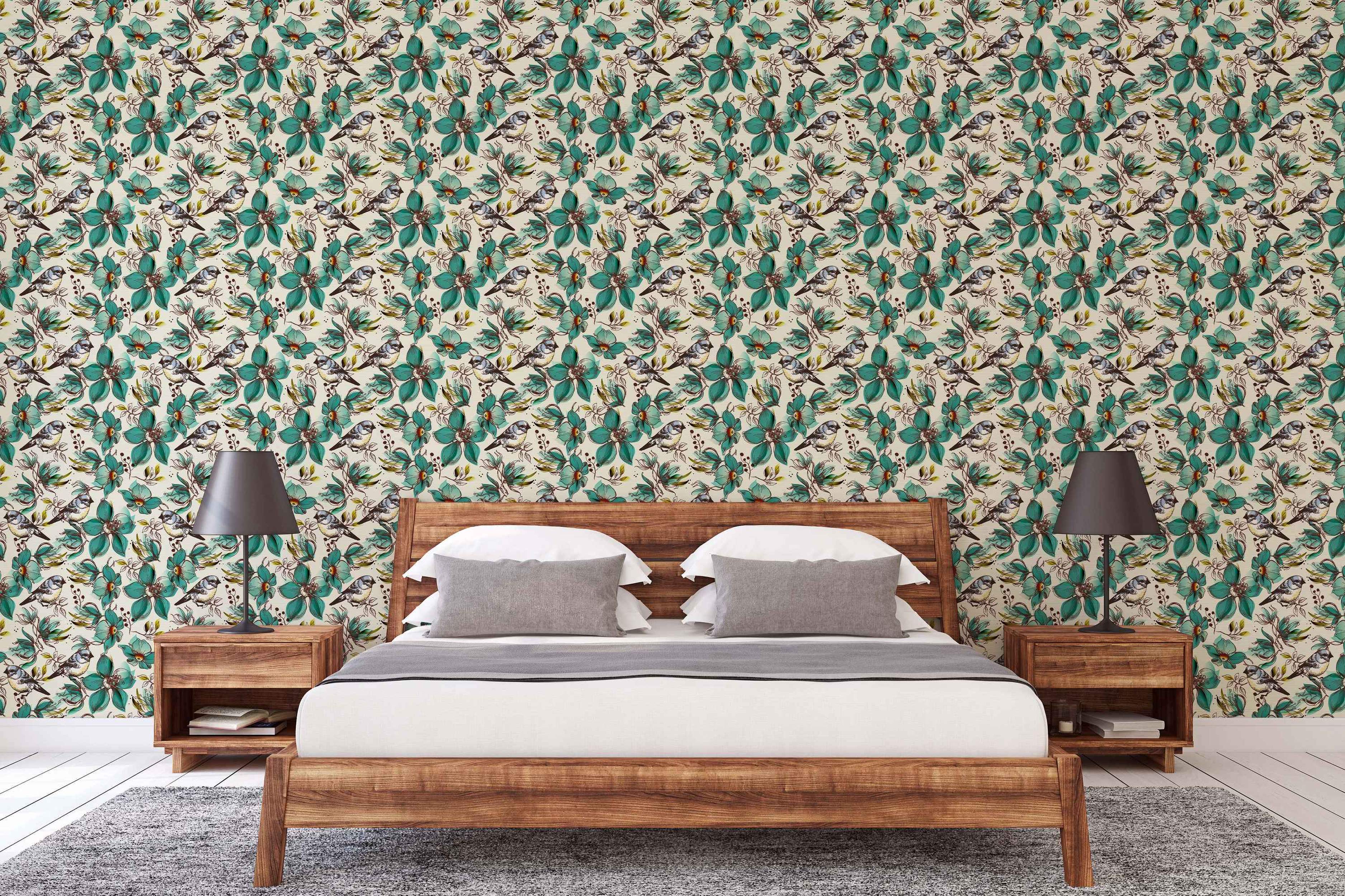 Repeating wallpaper pattern of teal flowers, yellow-breasted birds, and sketched leaves on a light background.