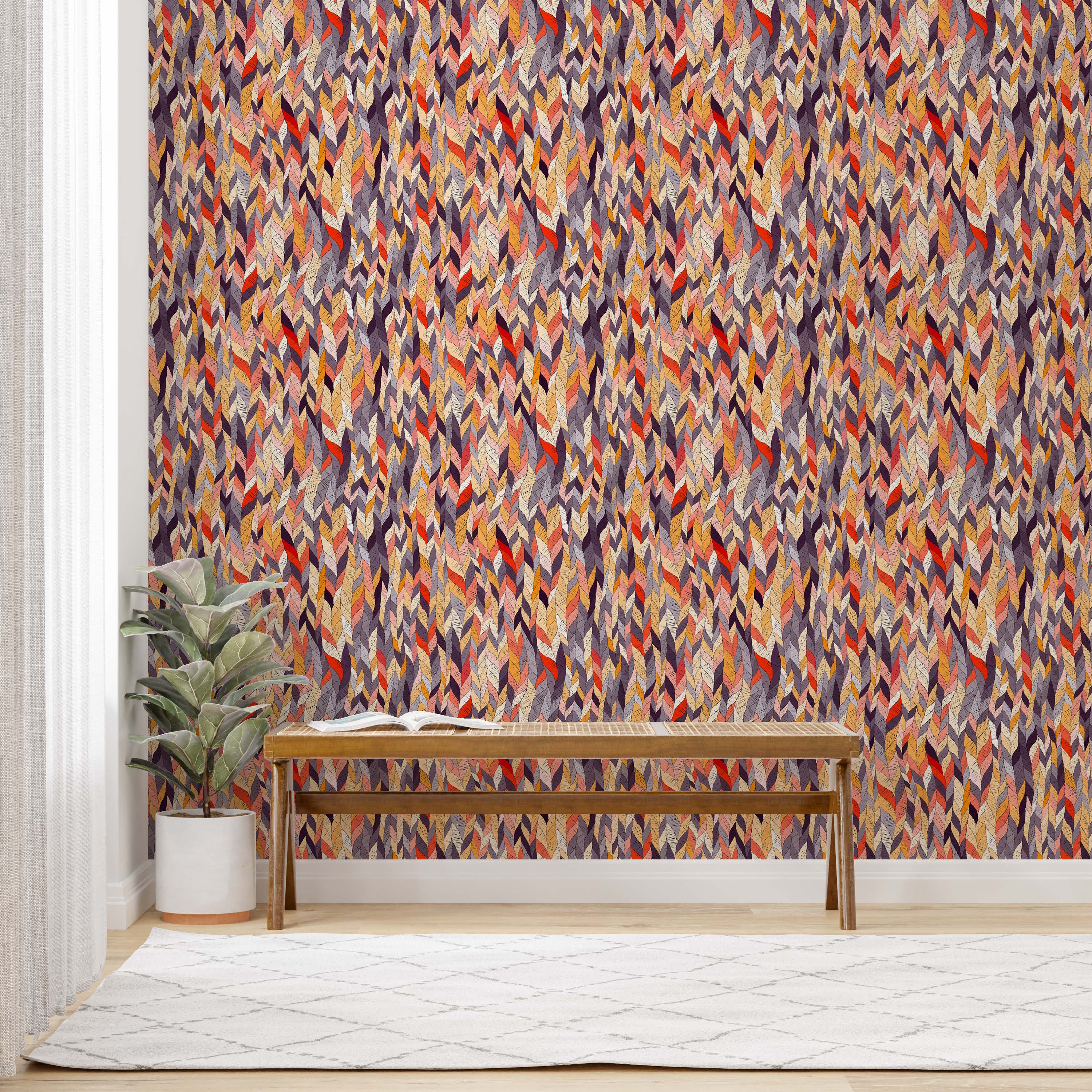 Wallpaper with a dense, textured pattern of overlapping, stylized leaves in warm reds, oranges, yellows, purples, and grays.