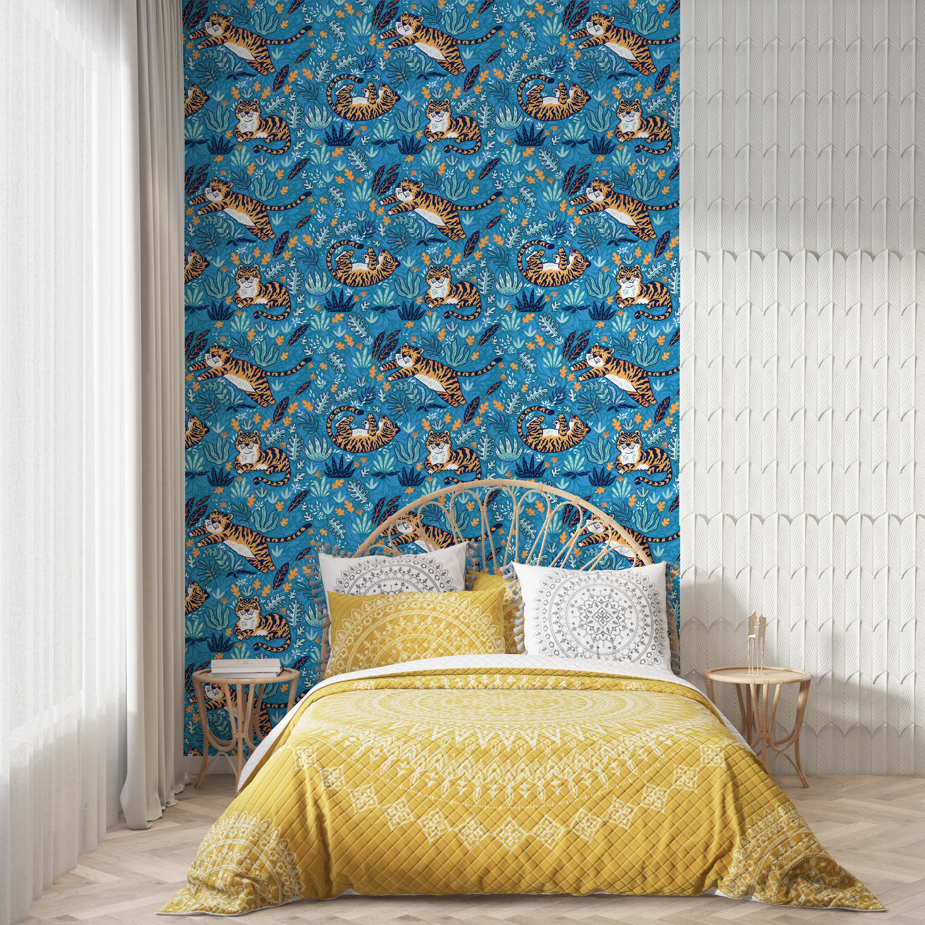 Playful wallpaper with illustrated orange tigers lounging and leaping amongst teal and orange jungle leaves on a blue background.