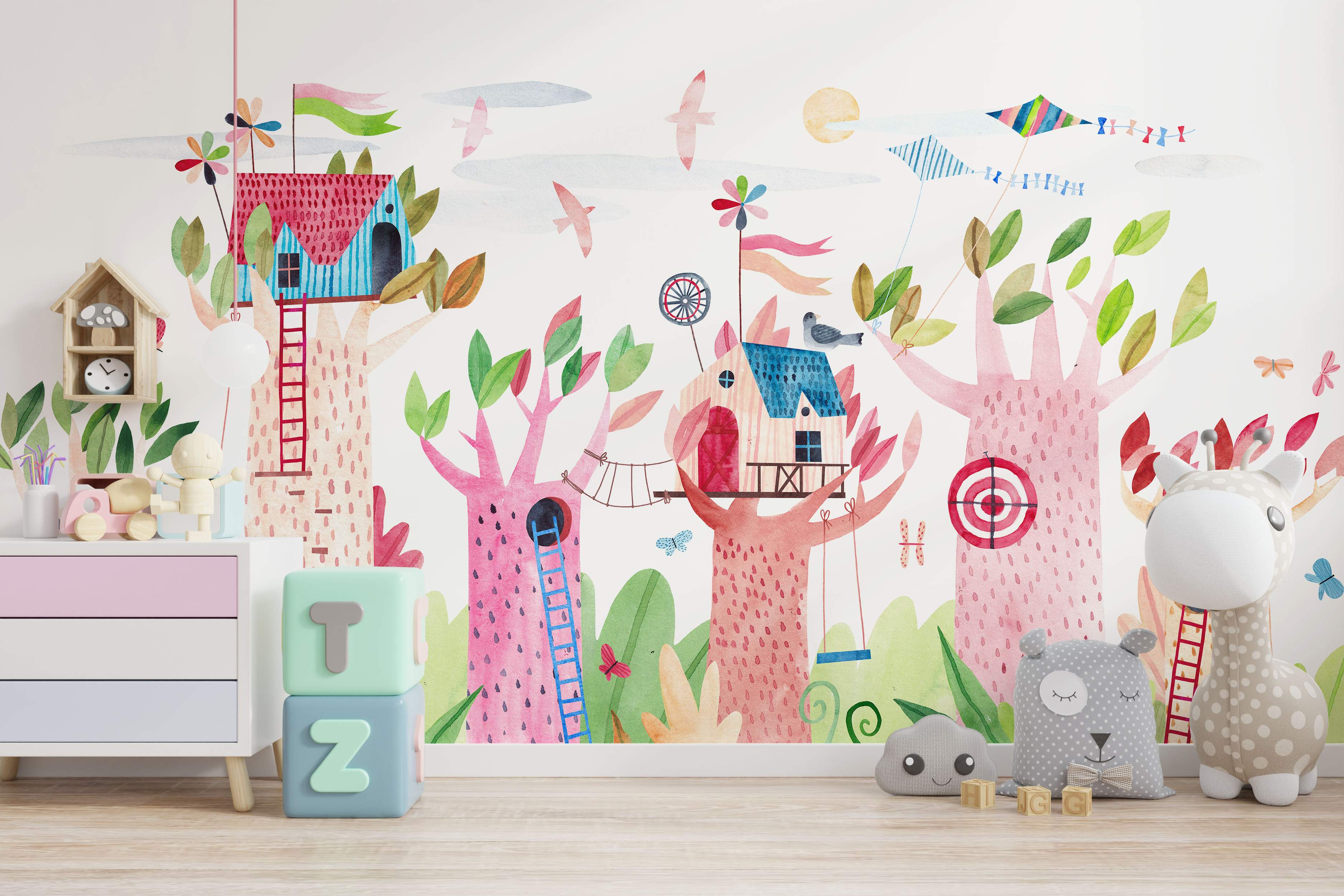 Whimsical watercolor mural depicting colorful treehouses on pink trees, with birds, kites, and butterflies.