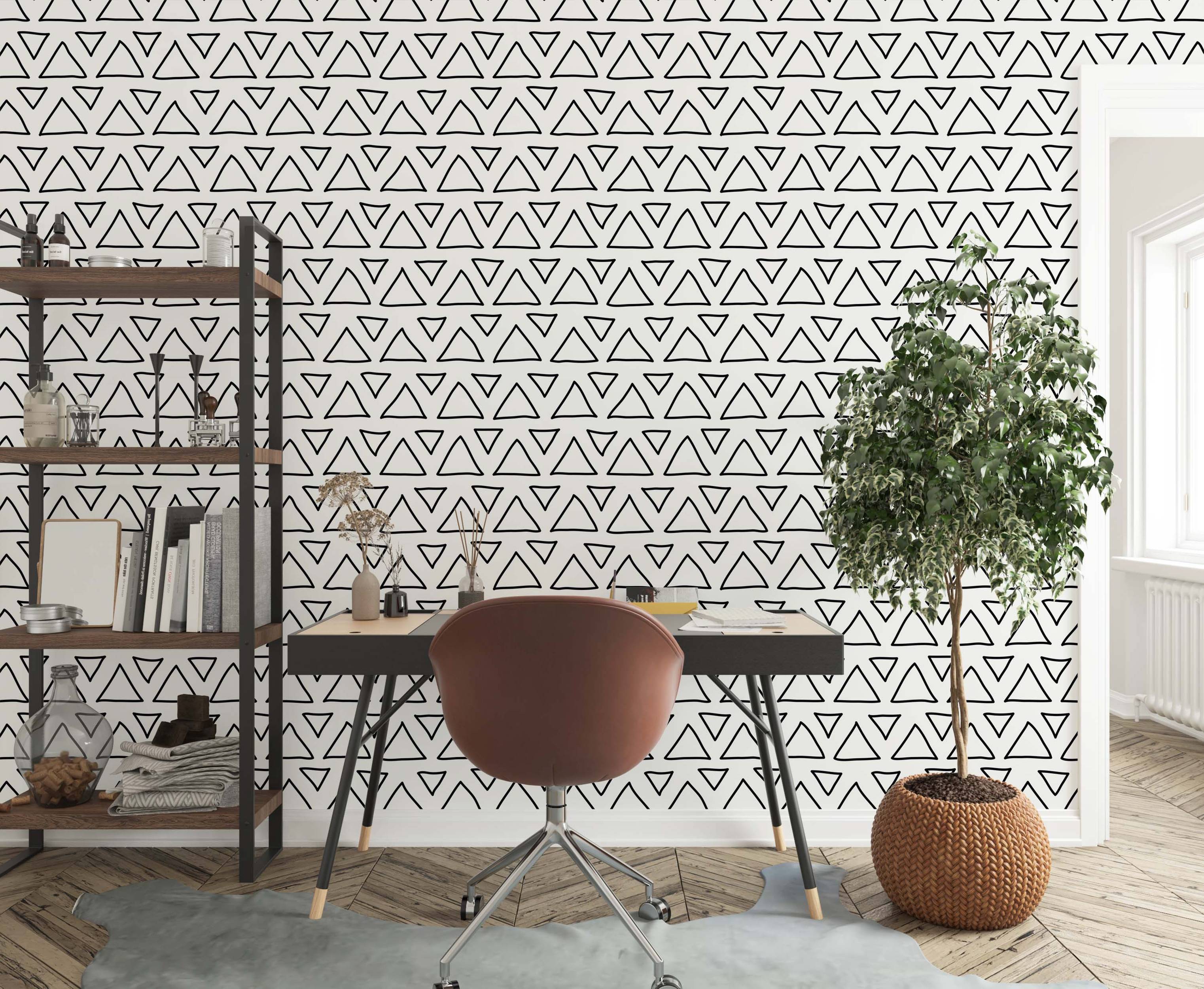 Hand-drawn black triangle outline wallpaper with rows of alternating up and down triangles on a white background.