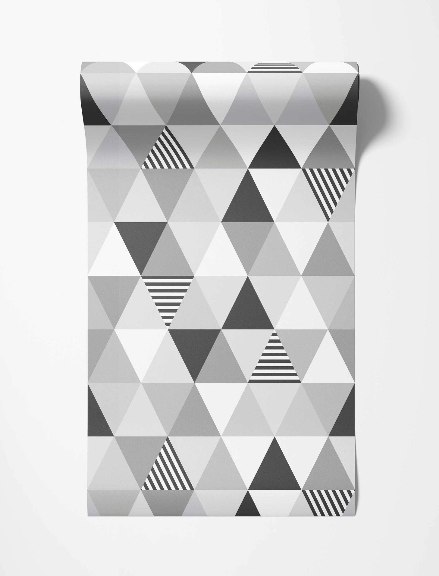 Geometric wallpaper featuring triangles in white, light gray, dark gray, and black and white stripes in a repeating pattern.