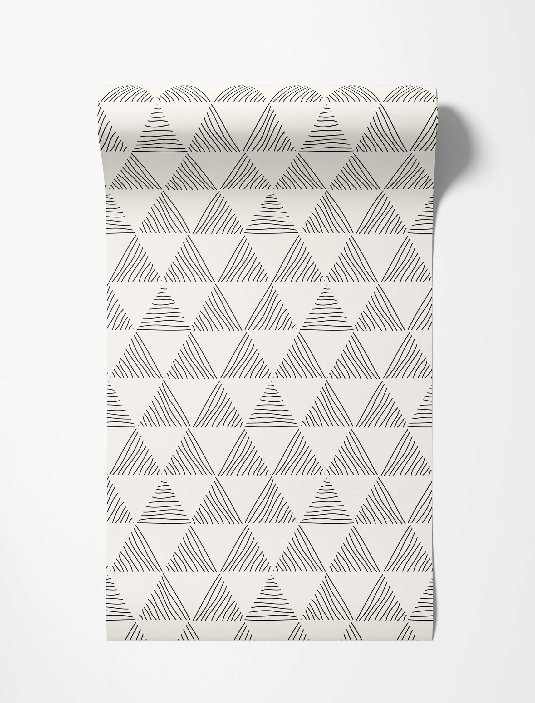 Geometric wallpaper featuring hand-drawn black triangles filled with varied lines on an off-white background.