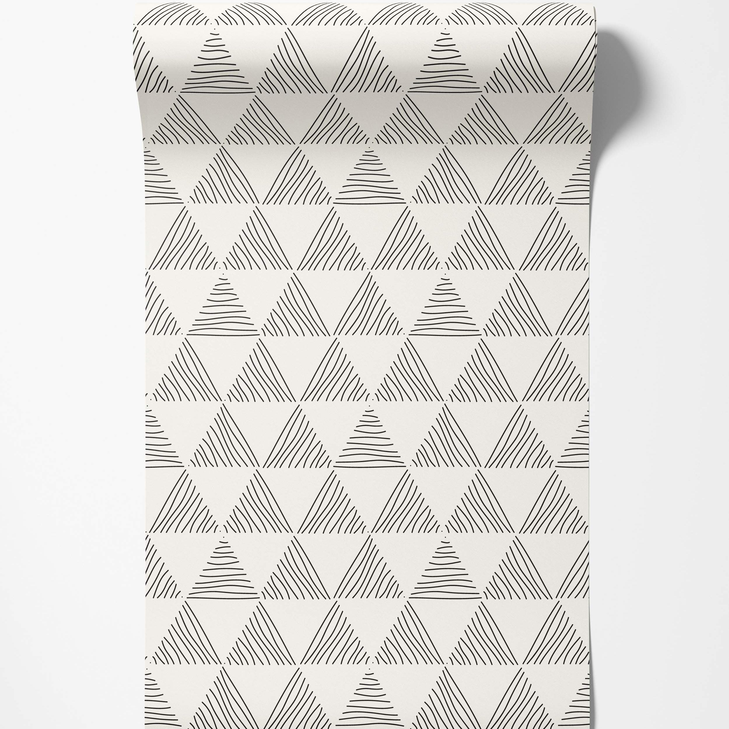 Geometric wallpaper featuring hand-drawn black triangles filled with varied lines on an off-white background.