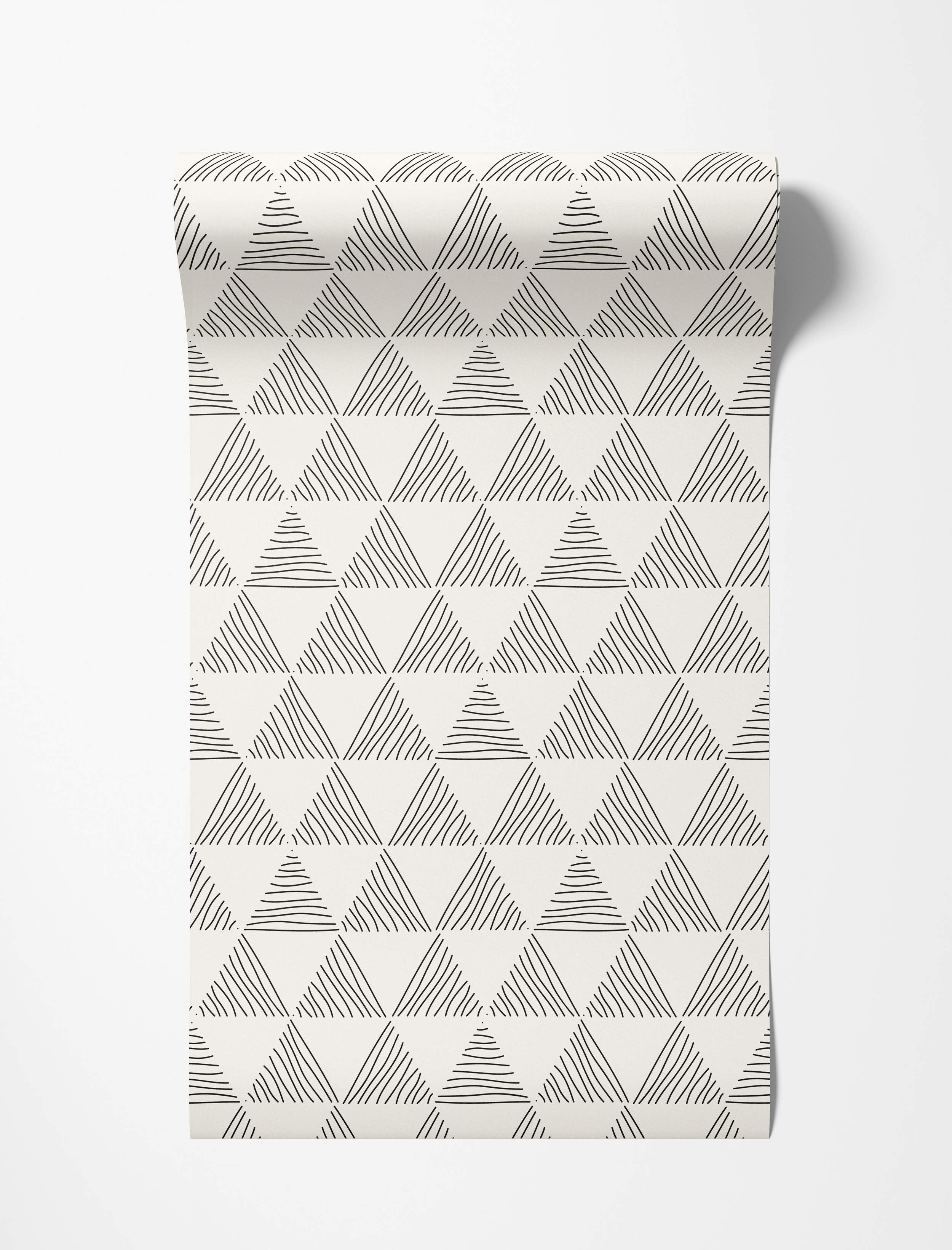 Geometric wallpaper featuring hand-drawn black triangles filled with varied lines on an off-white background.