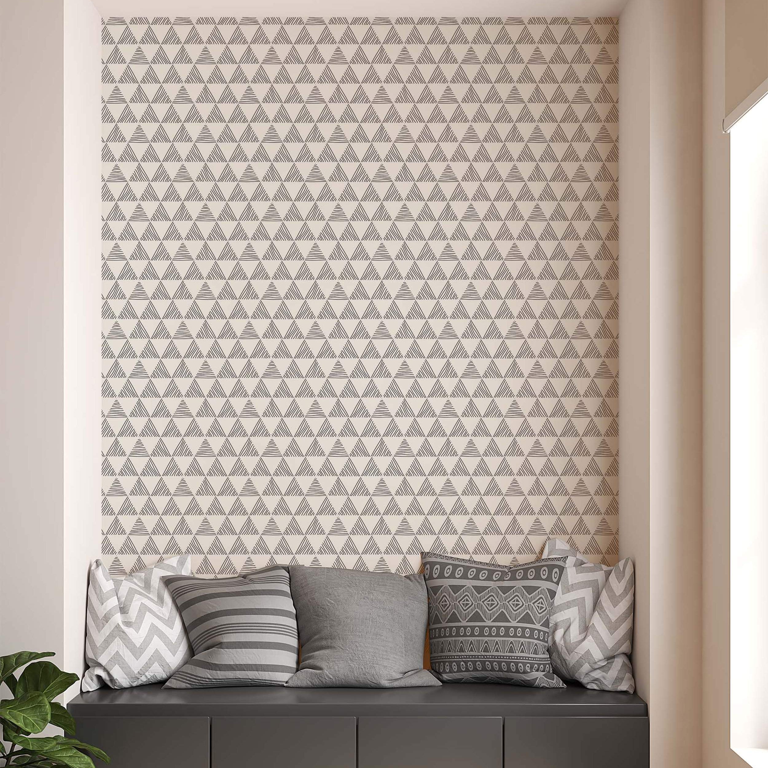 Wallpaper featuring a repeating pattern of triangles filled with sketchy horizontal gray lines on an off-white background.