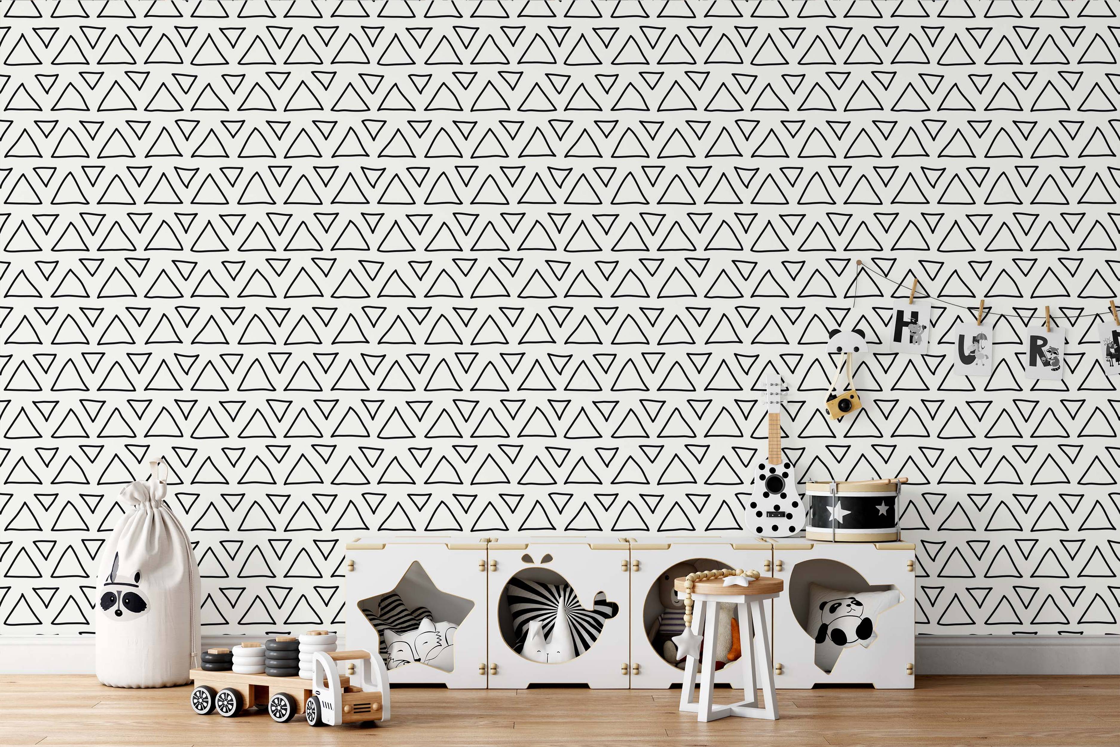 Wallpaper featuring a repeating pattern of hand-drawn black outline triangles, both upright and inverted, on a white background.