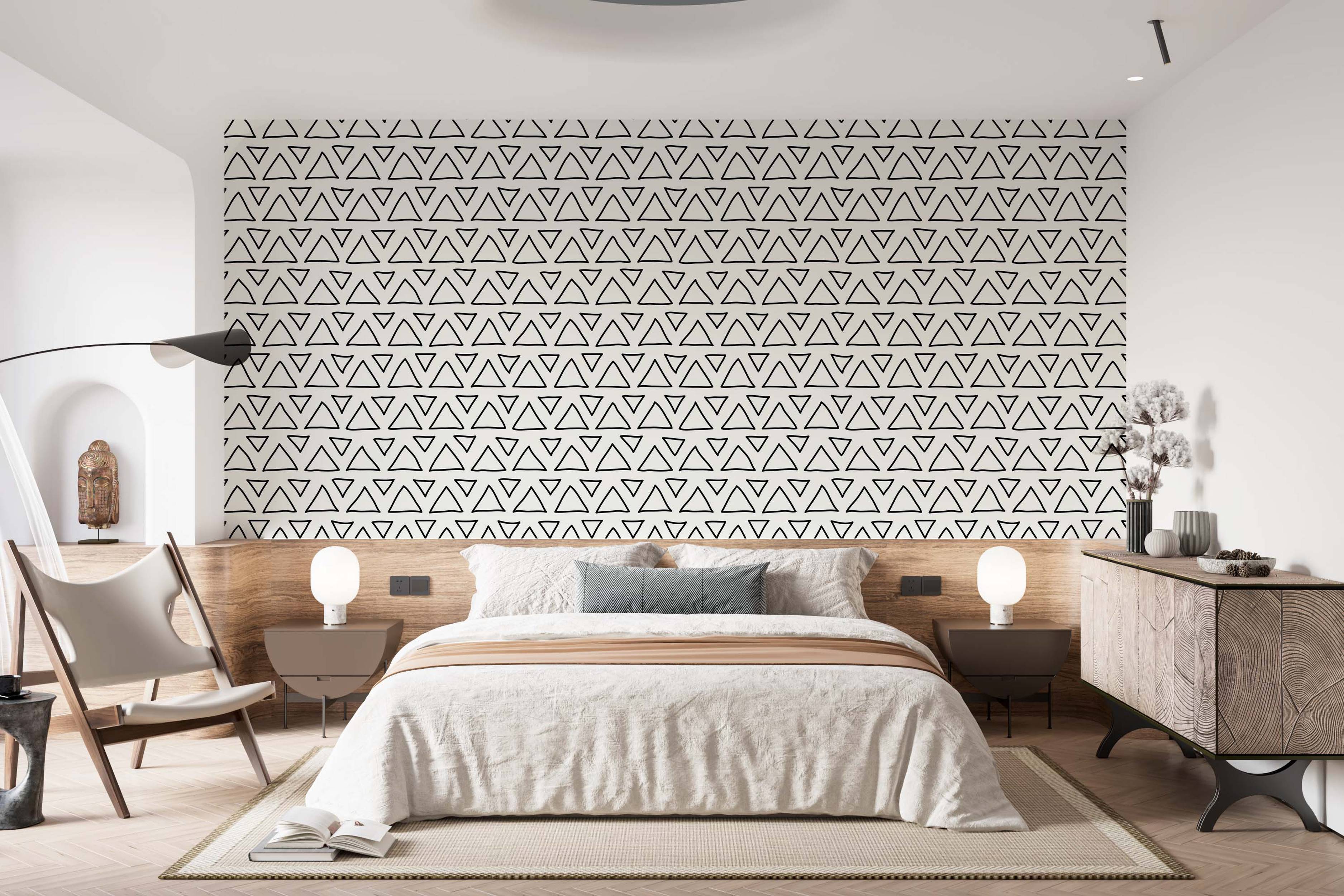 Wallpaper features a repeating pattern of hand-drawn black outline triangles, alternating orientation, on a light background.