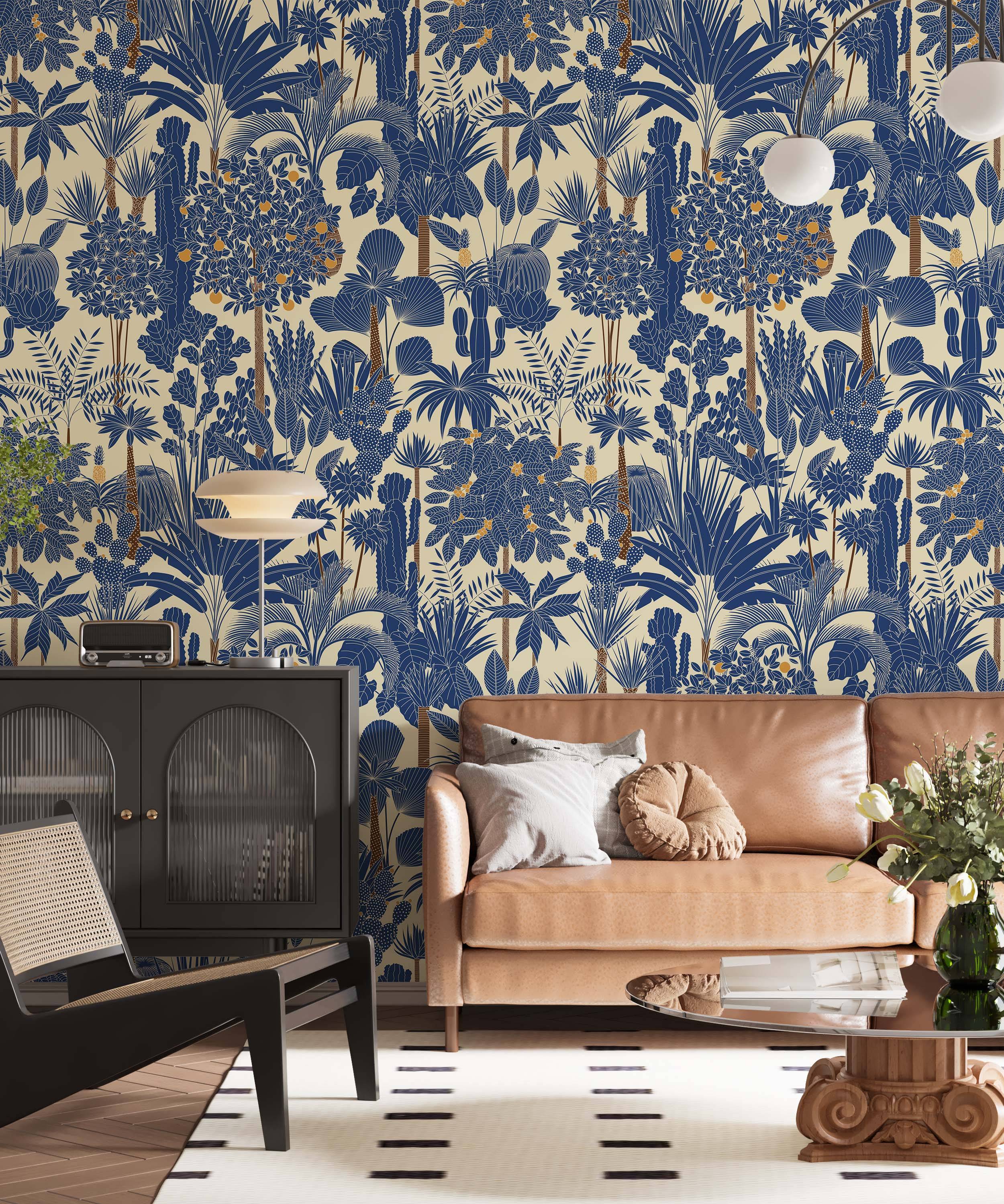 Stylized tropical botanical wallpaper featuring blue palm trees, cacti, and plants with orange fruits on a light beige background.