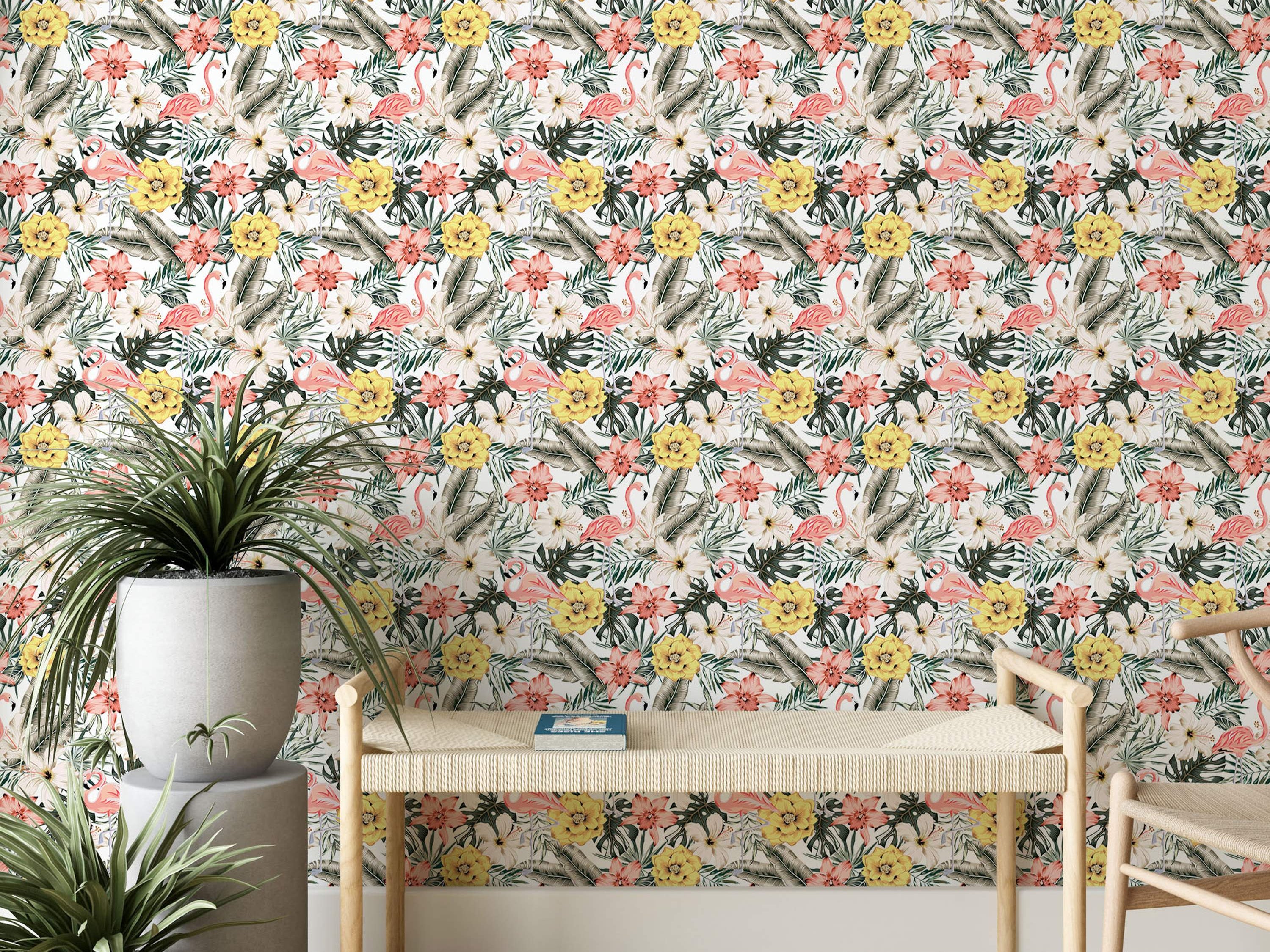 Watercolor tropical wallpaper featuring pink flamingos amidst yellow, pink, and white flowers and green tropical leaves.