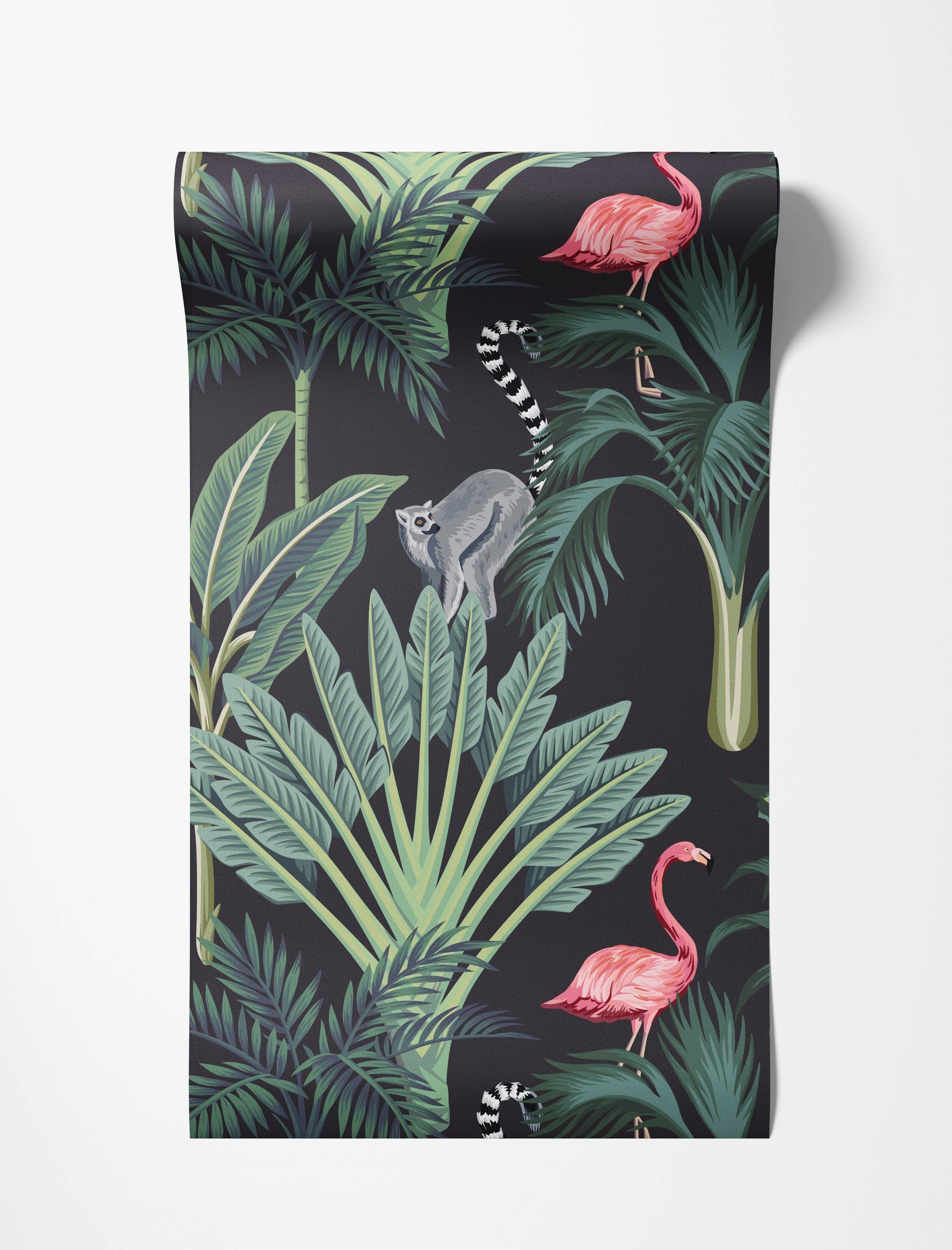 Tropical wallpaper with pink flamingos, a ring-tailed lemur, and green palm leaves on a dark charcoal background.