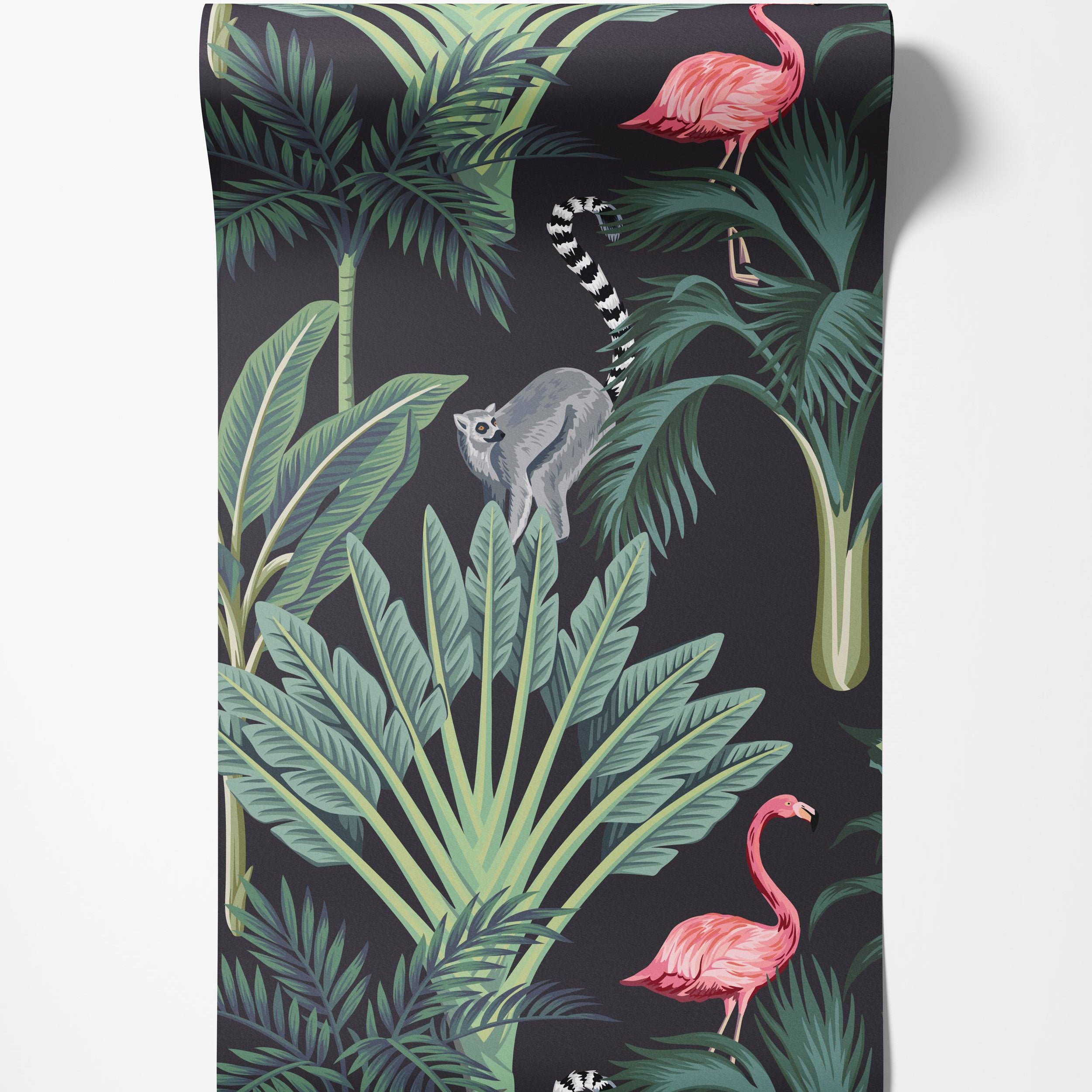 Tropical wallpaper with pink flamingos, a ring-tailed lemur, and green palm leaves on a dark charcoal background.