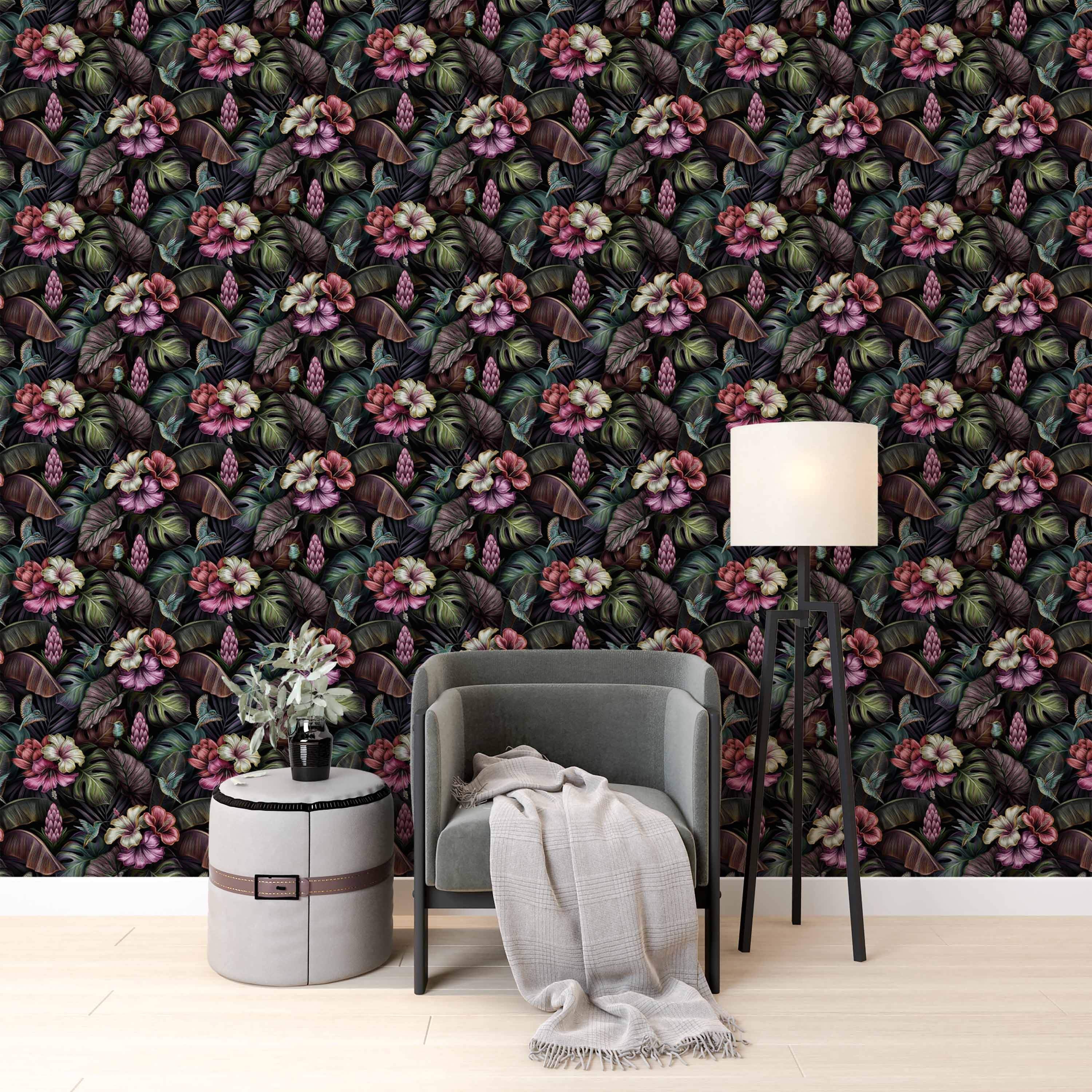 Dark tropical wallpaper featuring detailed pink hibiscus, lush green and purple leaves, ginger flowers, and small hummingbirds.