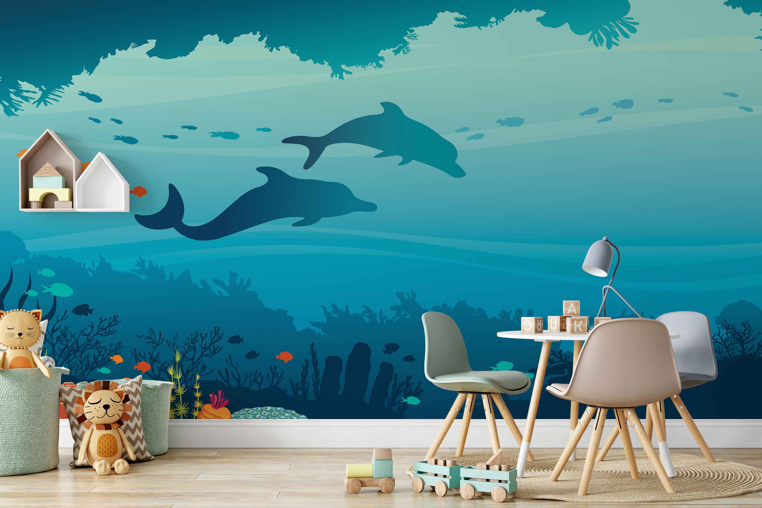 Underwater scene mural featuring blue silhouette dolphins, fish, and coral reefs against a gradient teal and blue sea background.