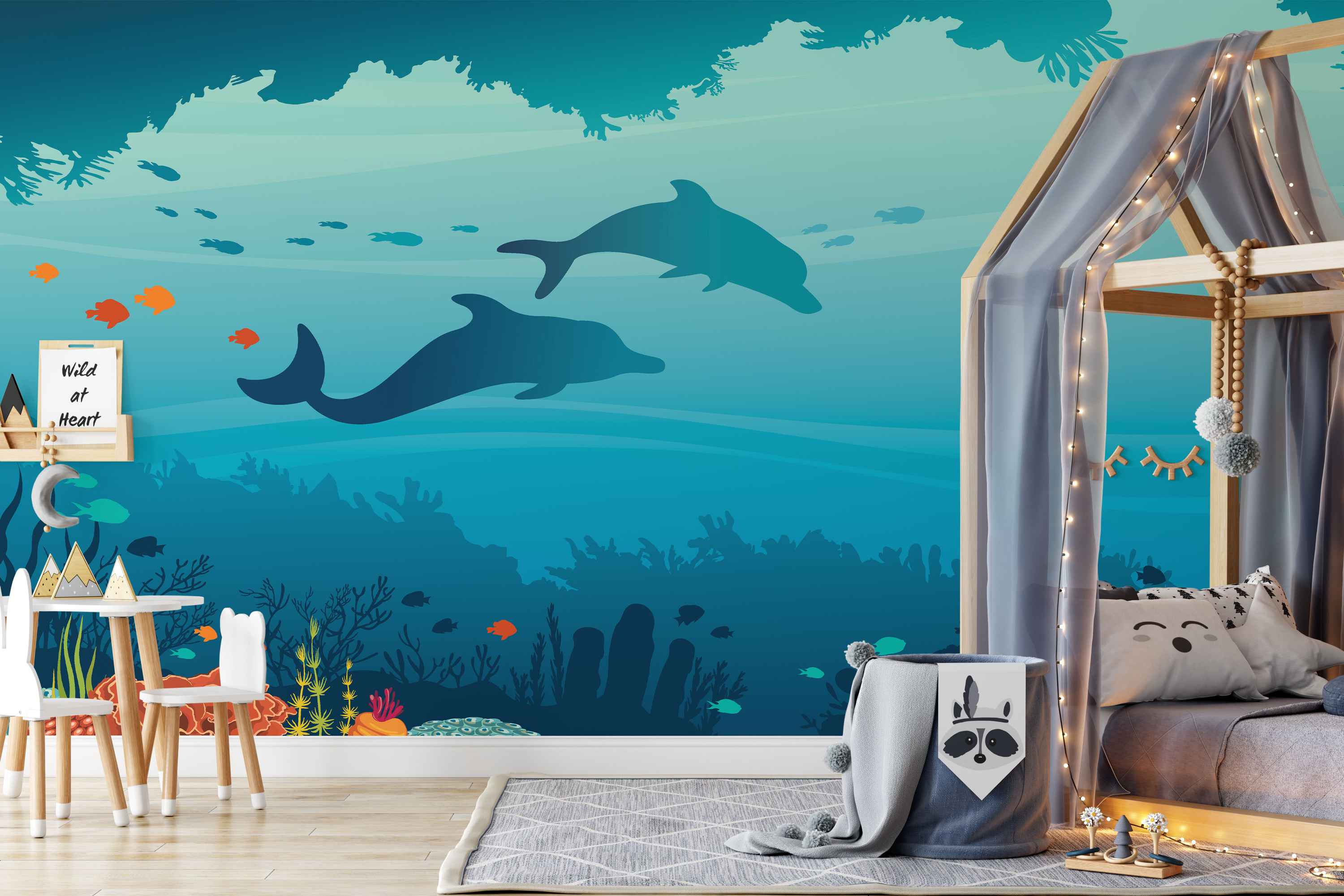 Mural featuring a blue underwater scene with silhouette dolphins, orange fish, and coral reef details.