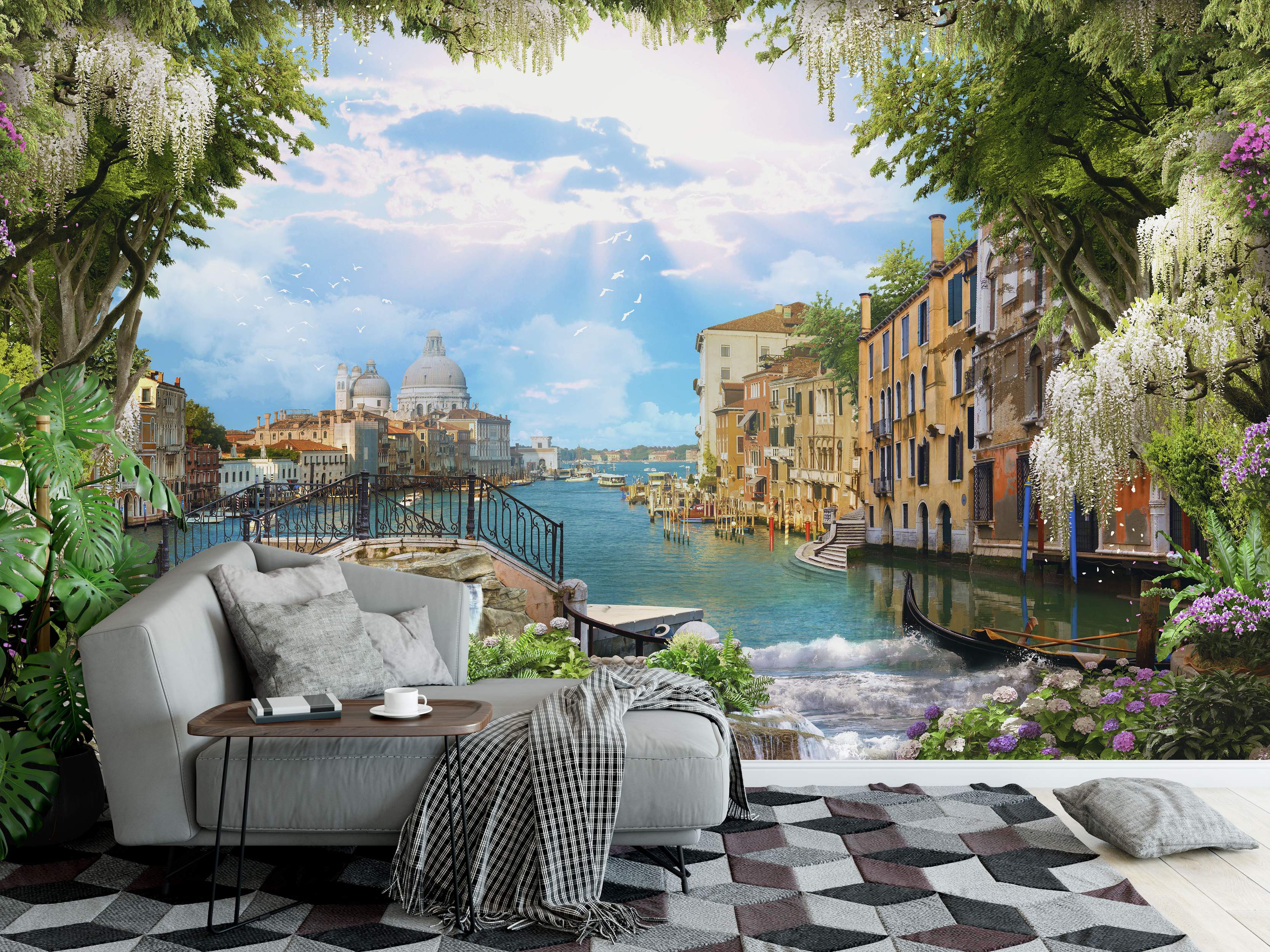 Scenic mural of a Venice canal with buildings, blue water, a bridge, and framed by green trees and hanging white flowers.