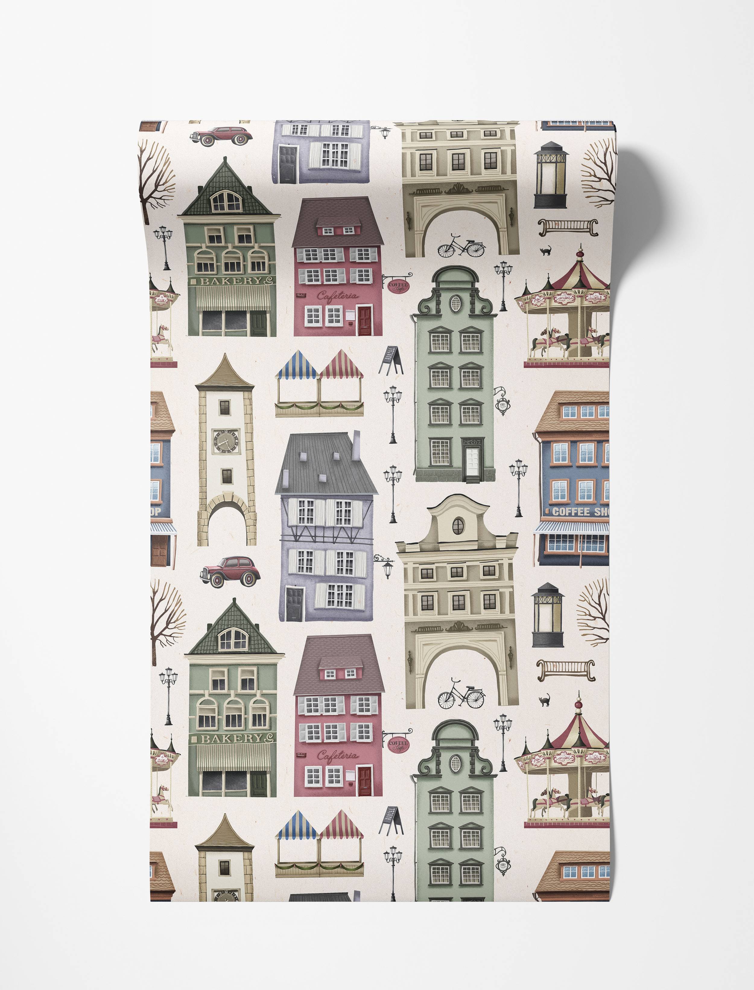 Vintage illustrated wallpaper with a repeating pattern of quaint European town buildings, a carousel, and street elements in soft hues.