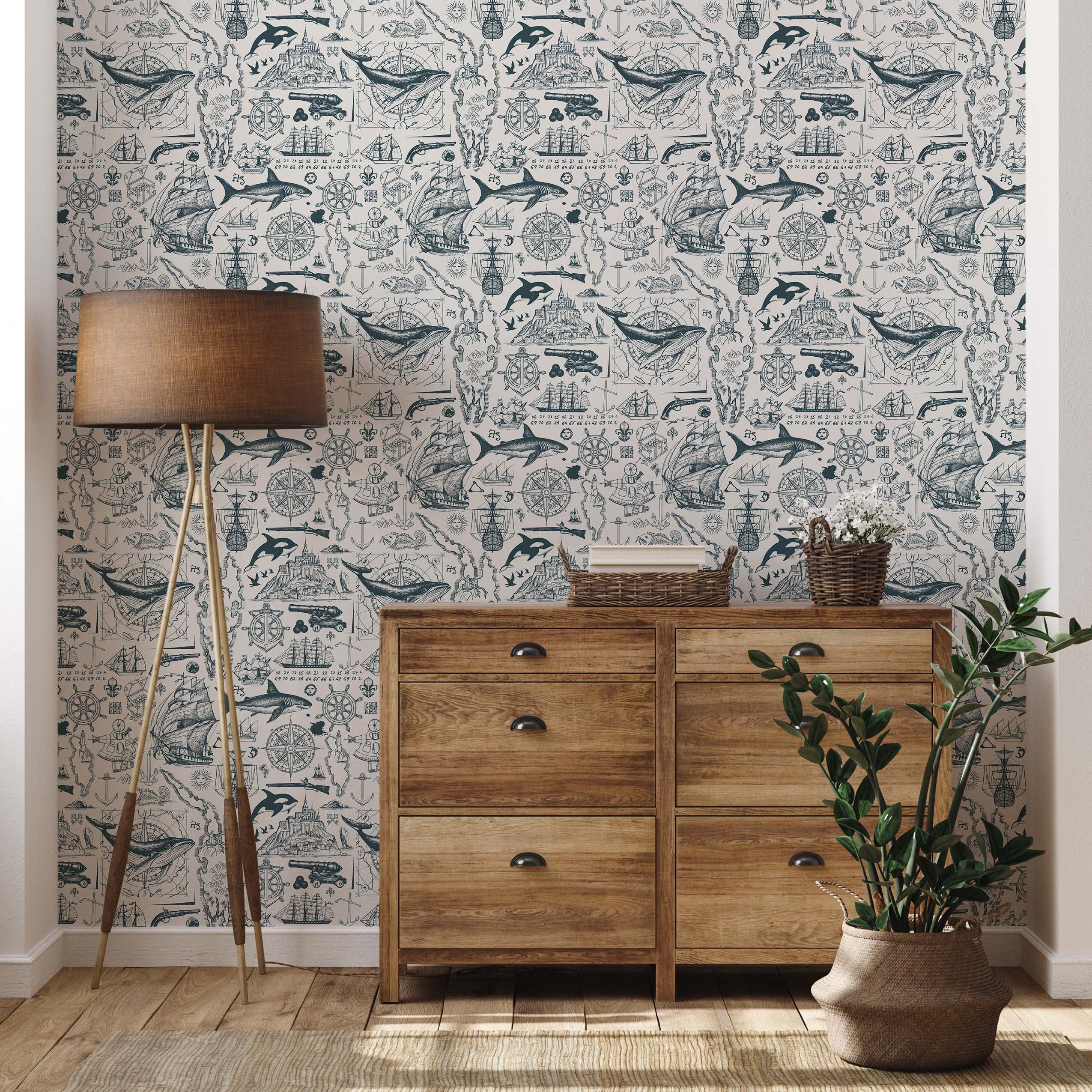 Vintage nautical sketch wallpaper in teal and cream, with a repeating pattern of ships, sea creatures, and map elements.