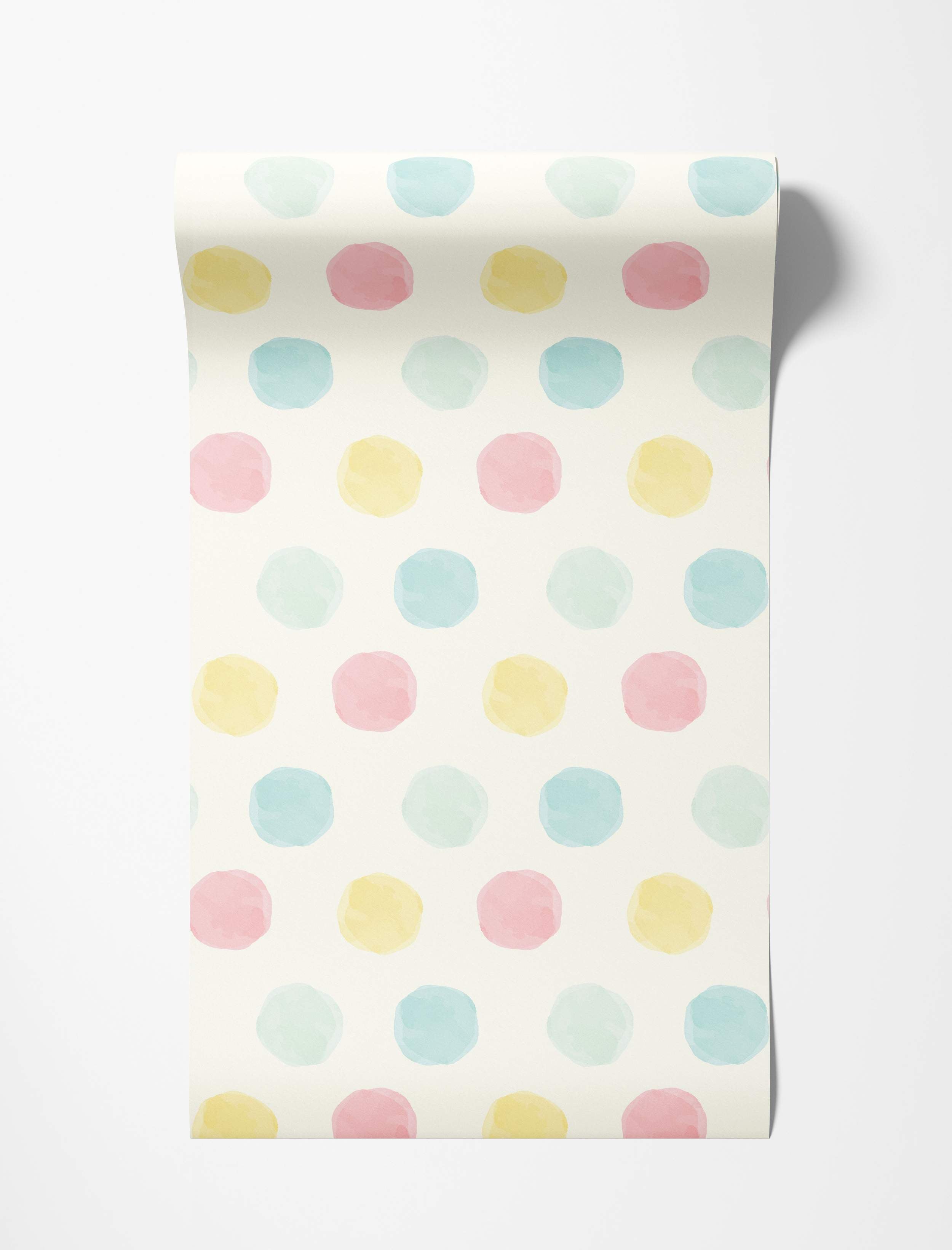 Soft watercolor polka dot wallpaper featuring pastel blue, pink, and yellow dots on a cream background.