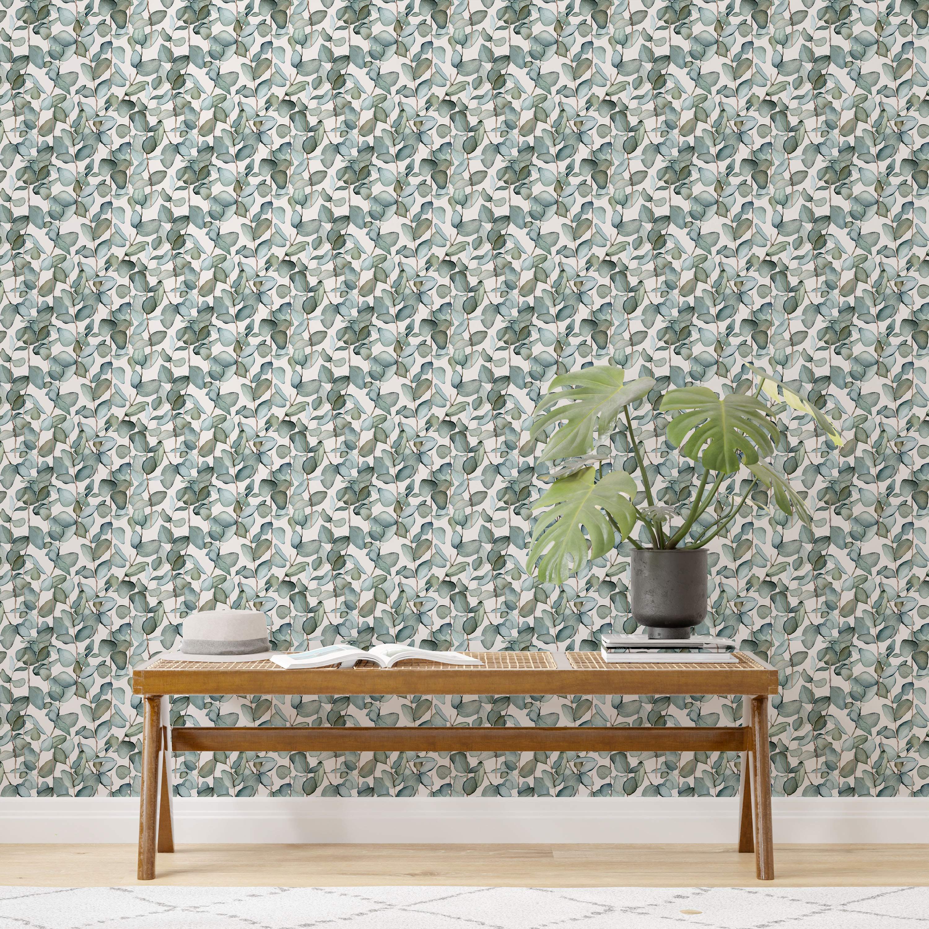 Watercolor wallpaper displaying vertical eucalyptus stems with muted green and blue-green leaves on an off-white background.