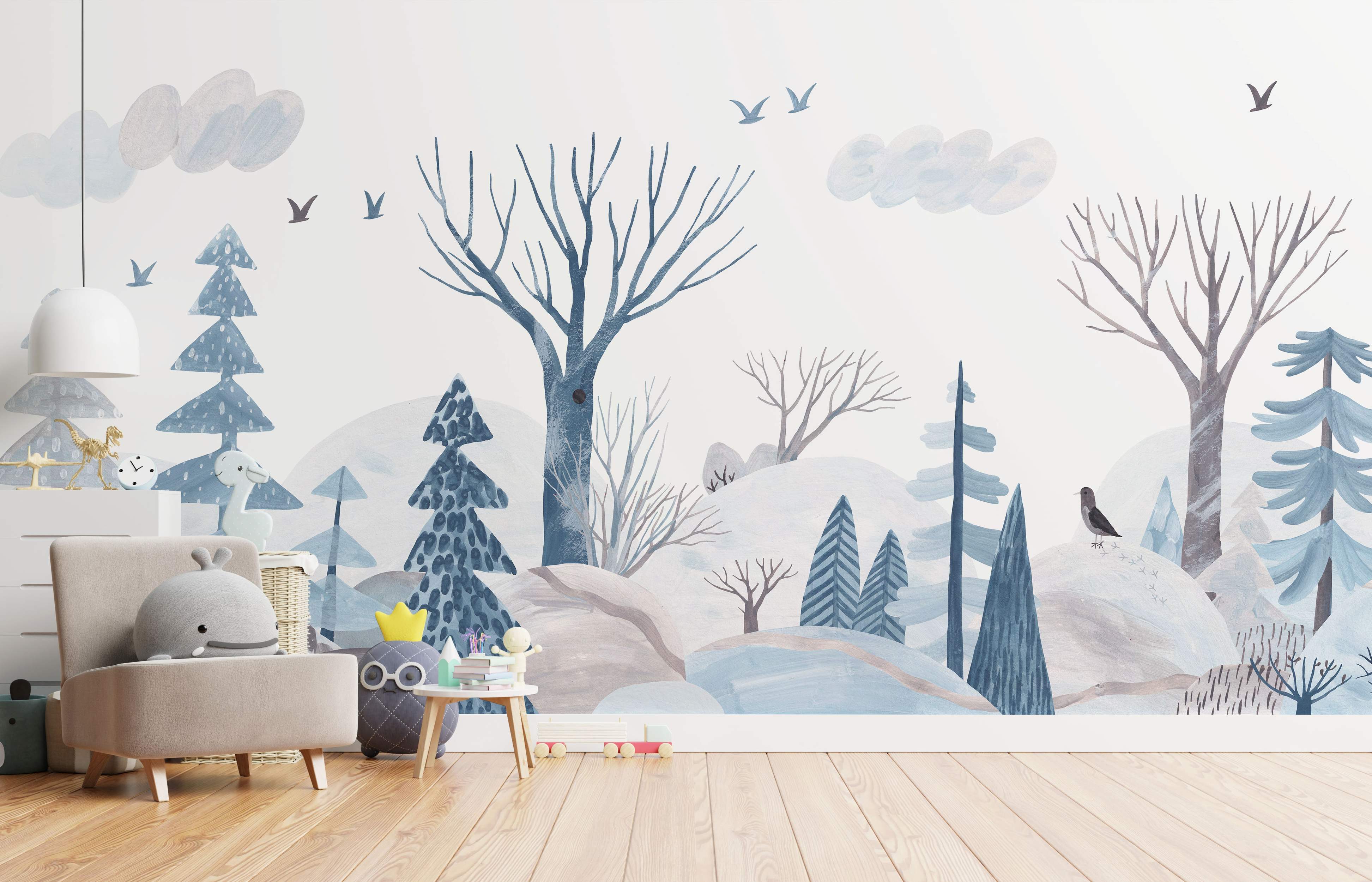 Whimsical watercolor mural of a winter forest scene with stylized blue and gray trees, hills, birds, and clouds.