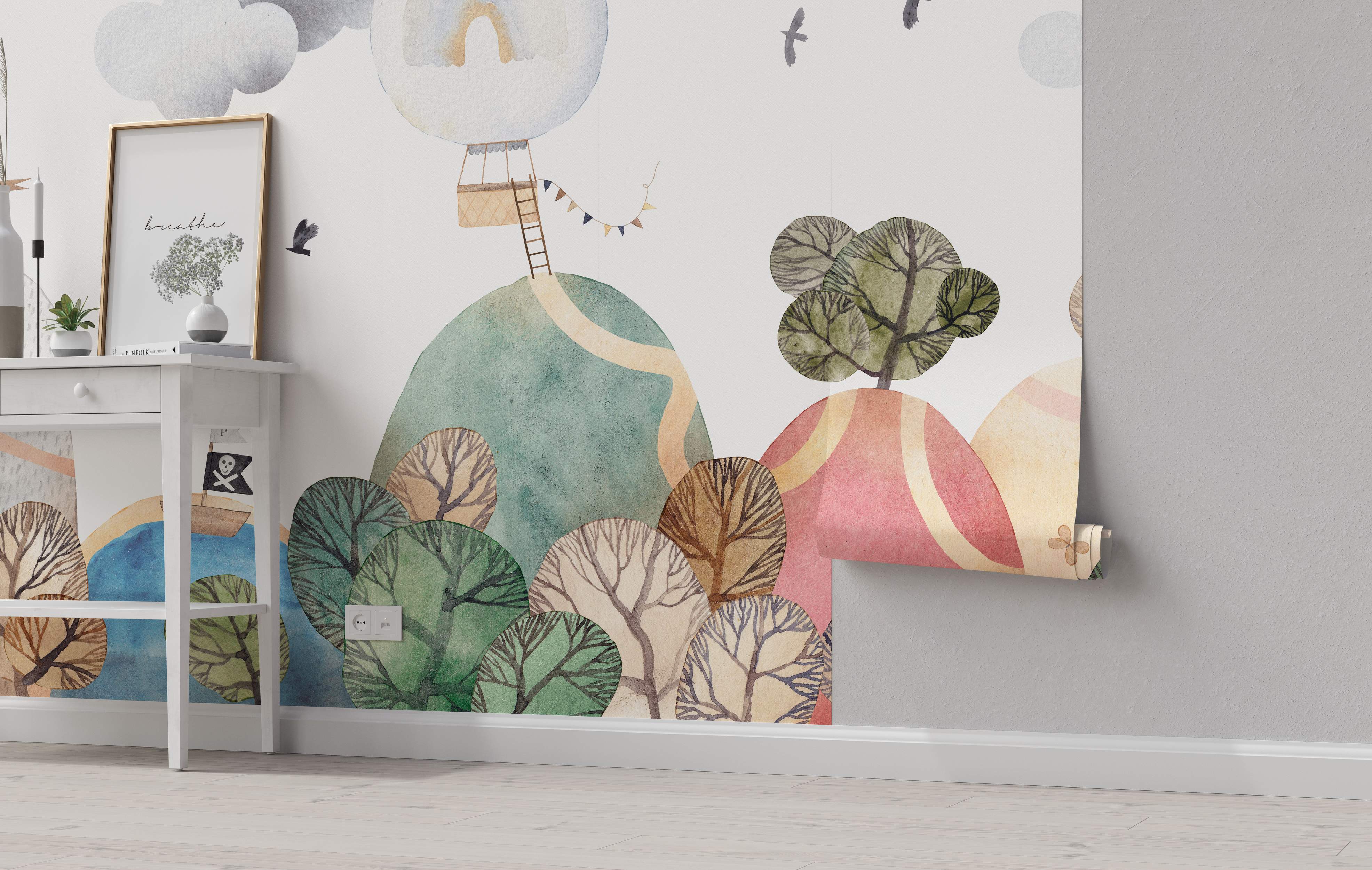 Whimsical watercolor landscape mural featuring green and pink rolling hills, stylized trees, a hot air balloon, and birds.