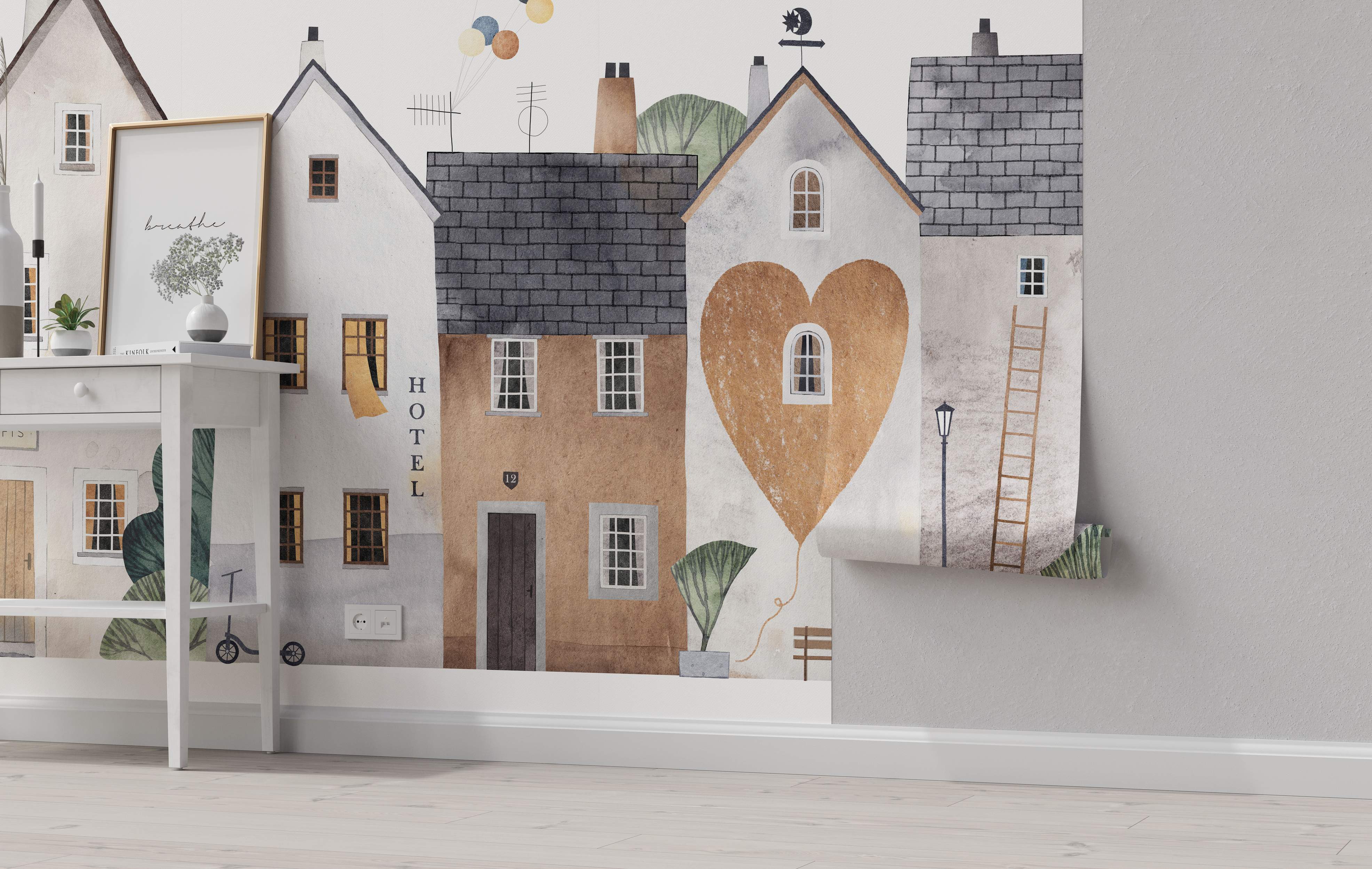 Watercolor mural depicting a charming street scene with stylized houses in white, gray, and beige, featuring a large heart motif.
