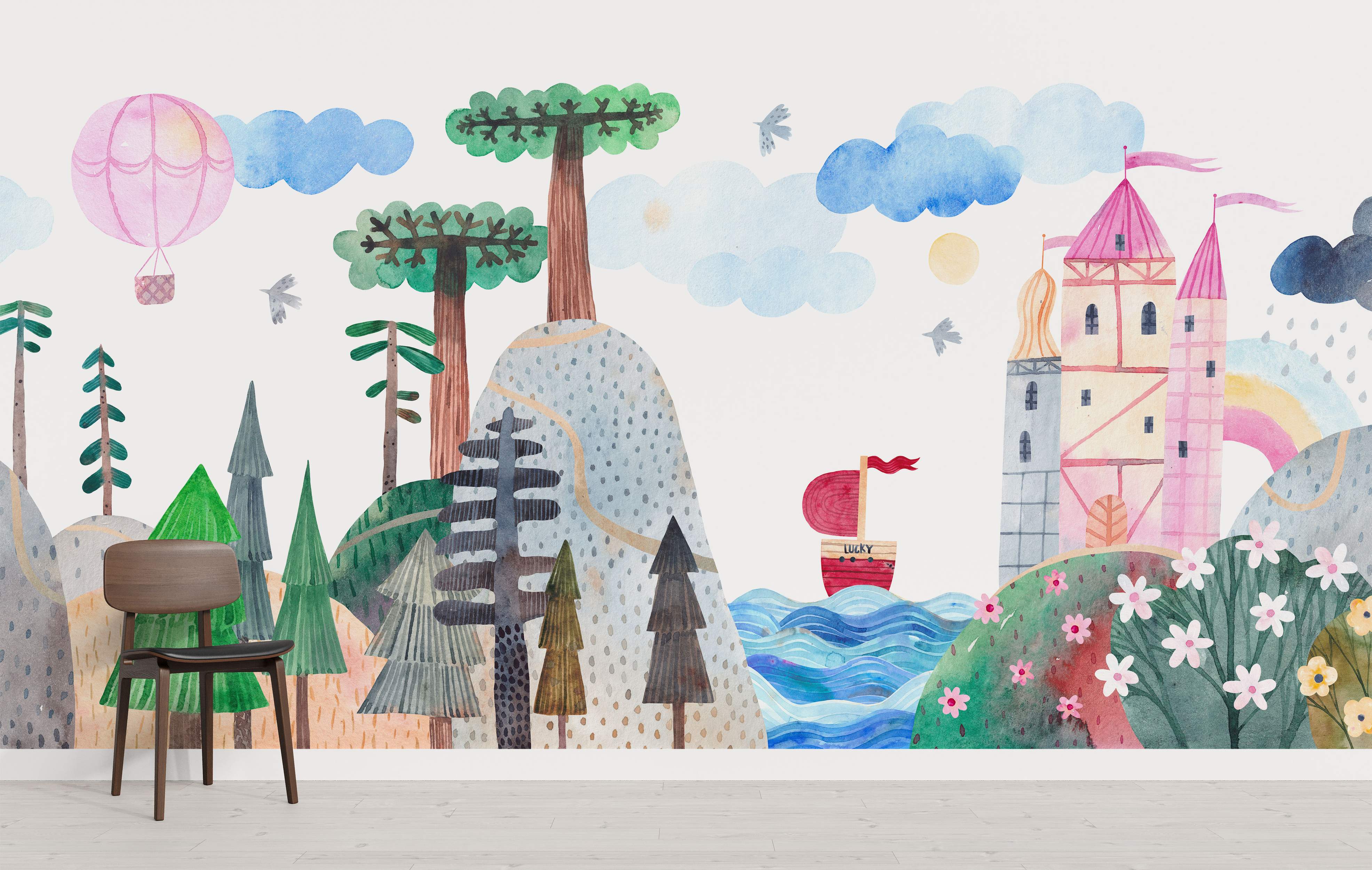 Whimsical watercolor landscape mural depicting a pink castle, stylized trees, a hot air balloon, and a ship on blue waves.