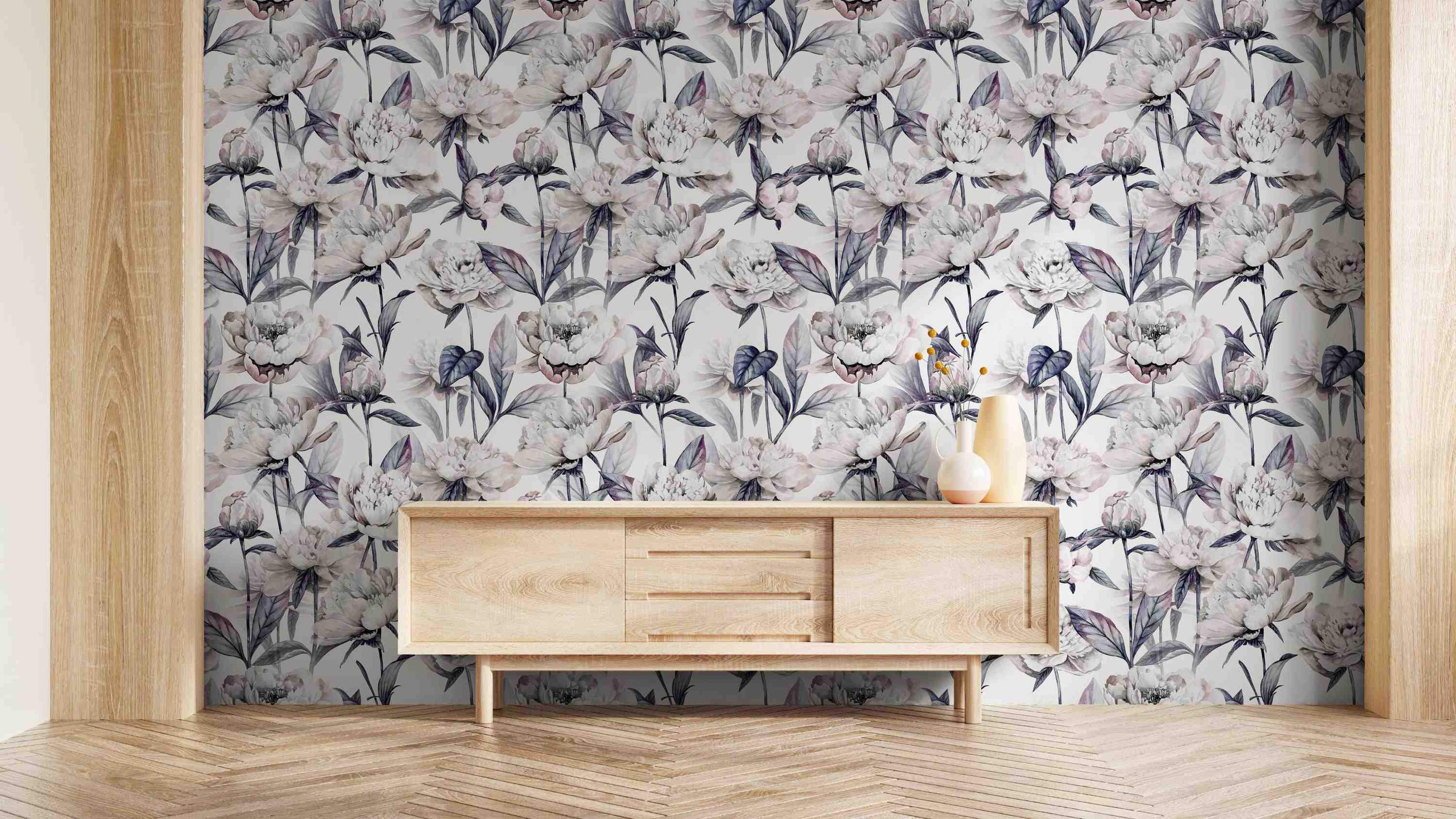 Muted watercolor floral wallpaper with large white and purple-gray peonies on a light background.