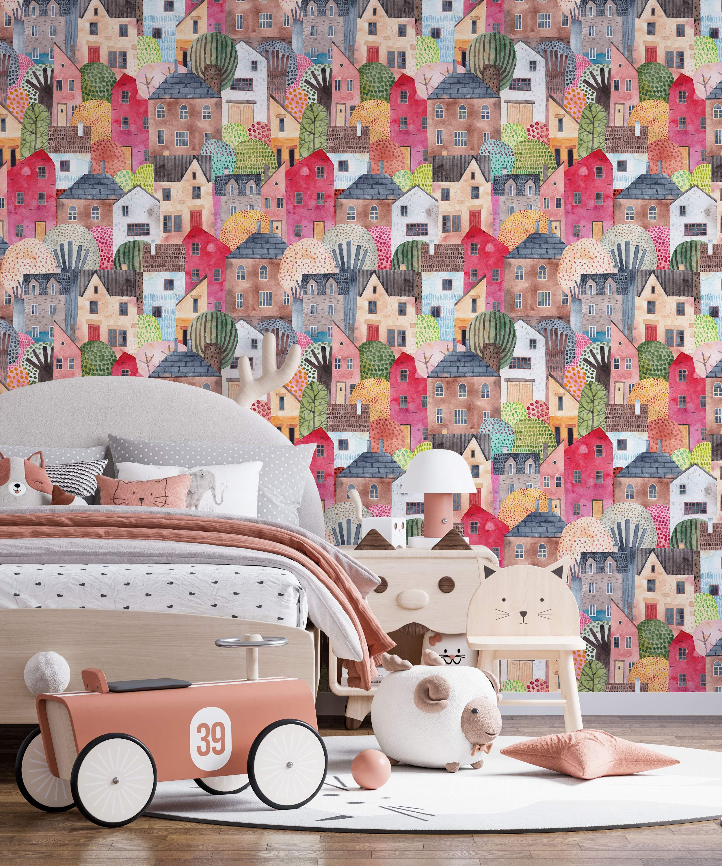 Whimsical wallpaper showing a dense watercolor village with colorful houses and trees in pink, red, brown, and blue hues.