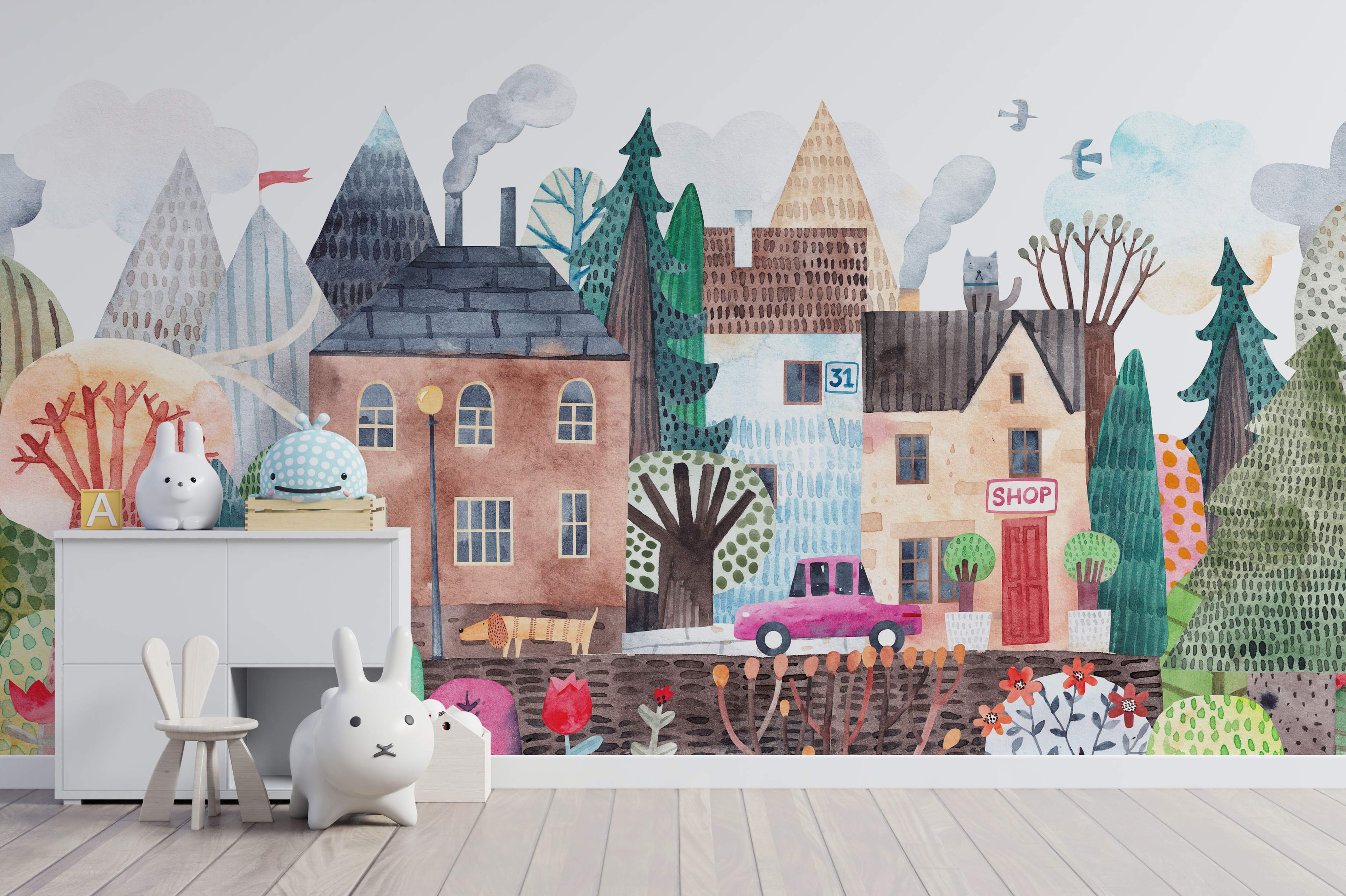 Charming watercolor village mural with stylized houses, trees, mountains, and animals in a soft, multicolor palette.