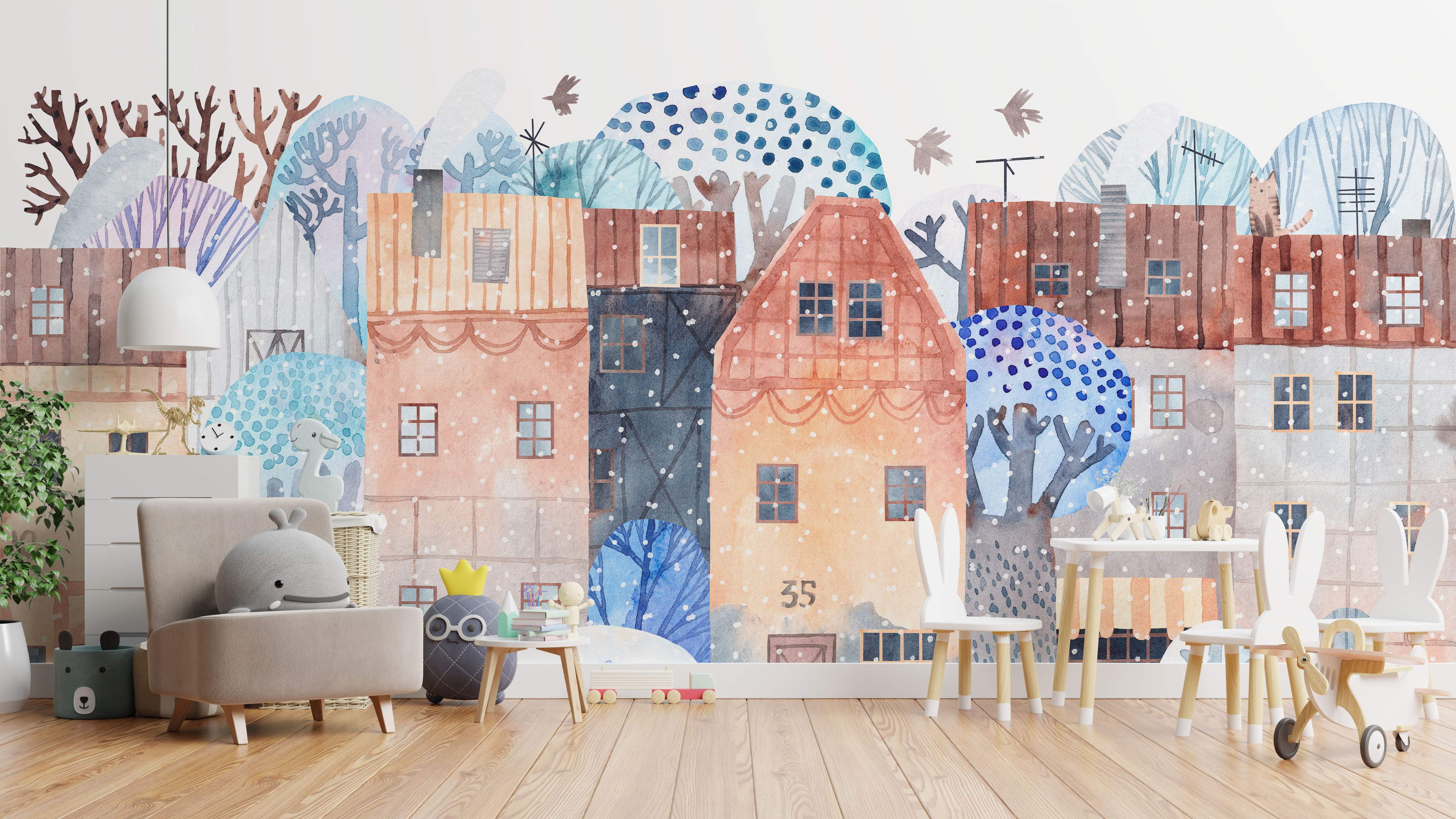Whimsical watercolor mural of a winter cityscape with terracotta, brown, and blue buildings, stylized trees, and falling snow.