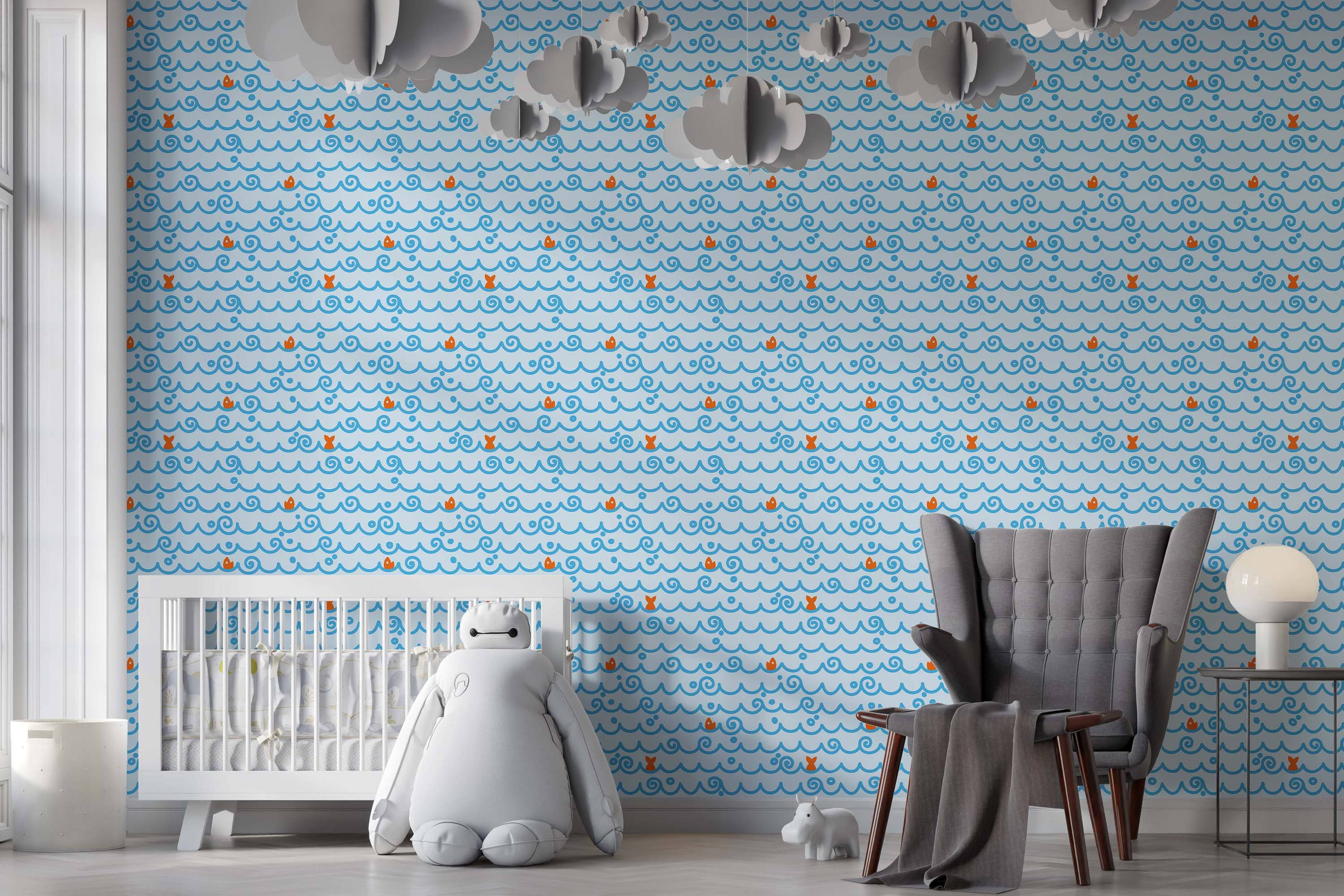 Wallpaper with a pattern of stylized blue ocean waves, swirls, dots, and small orange fish on a light blue background.