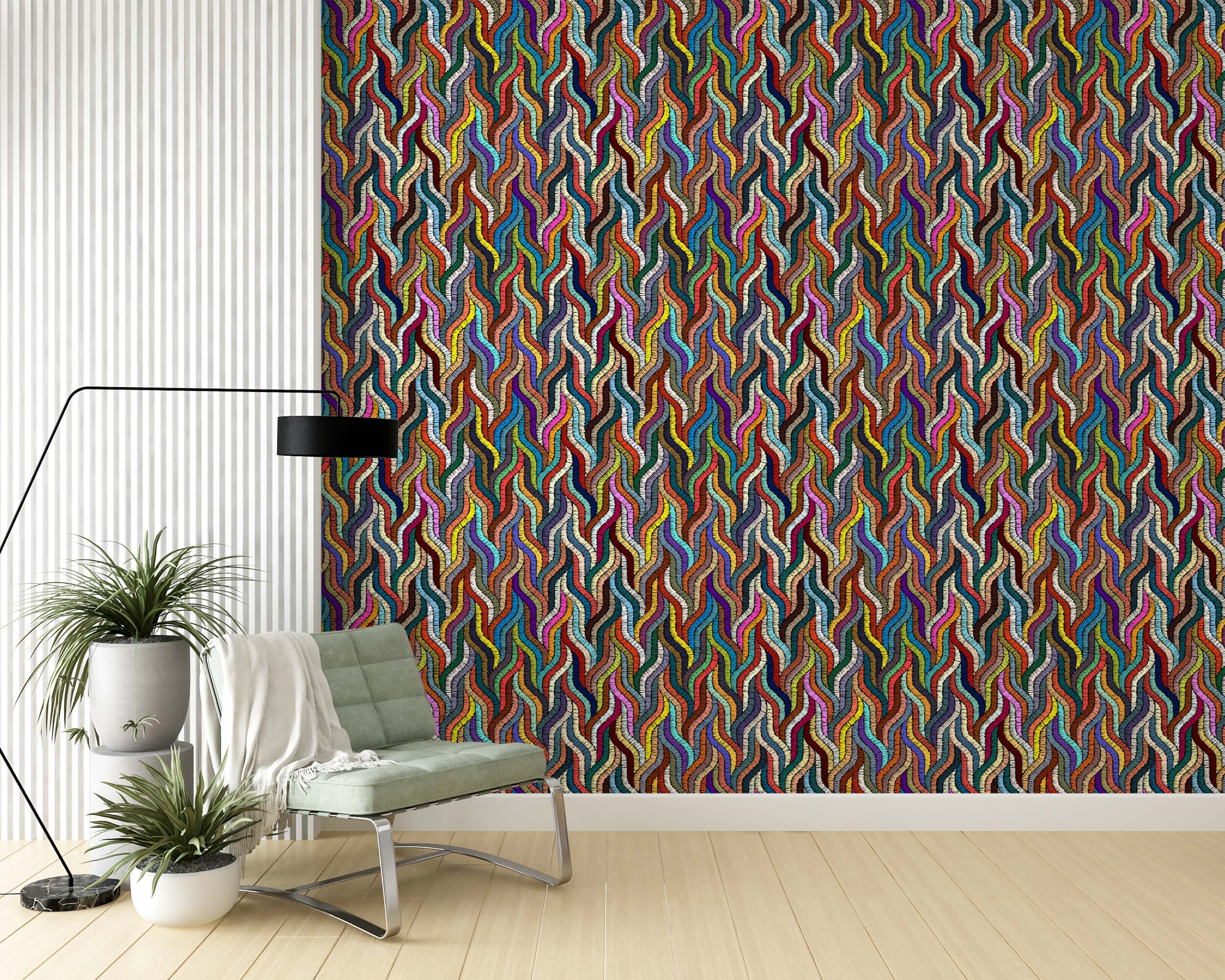 Wallpaper with a repeating pattern of colorful, embroidered-style vertical wavy lines in various hues.