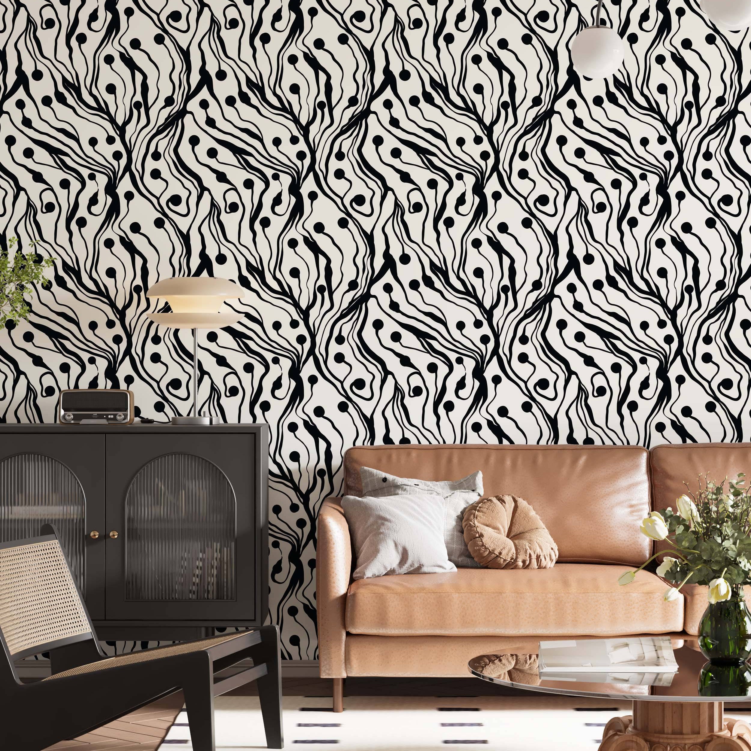 Abstract wallpaper featuring bold, wavy black lines and scattered black dots resembling organic forms on a cream background.