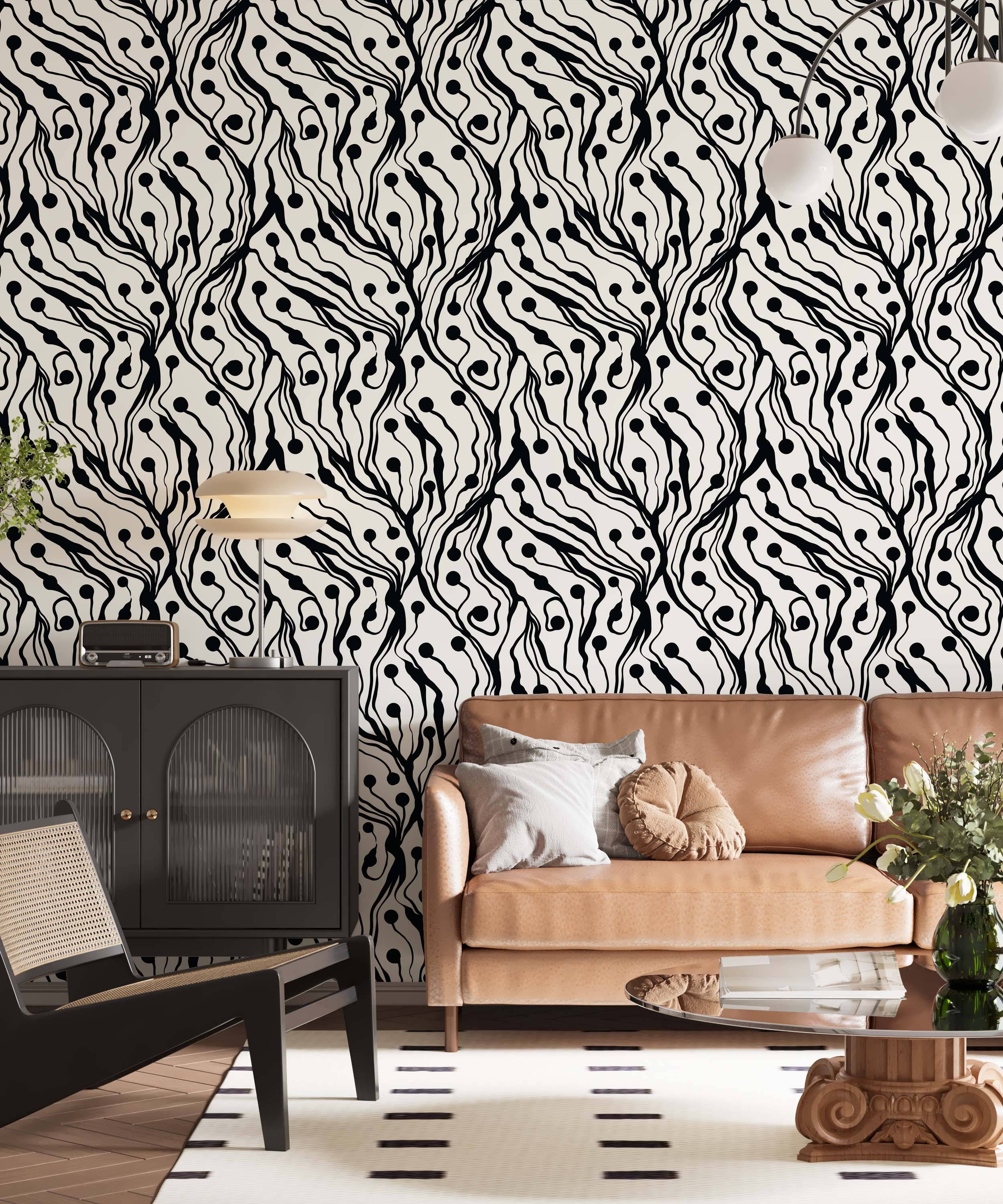 Abstract wallpaper featuring bold, wavy black lines and scattered black dots resembling organic forms on a cream background.