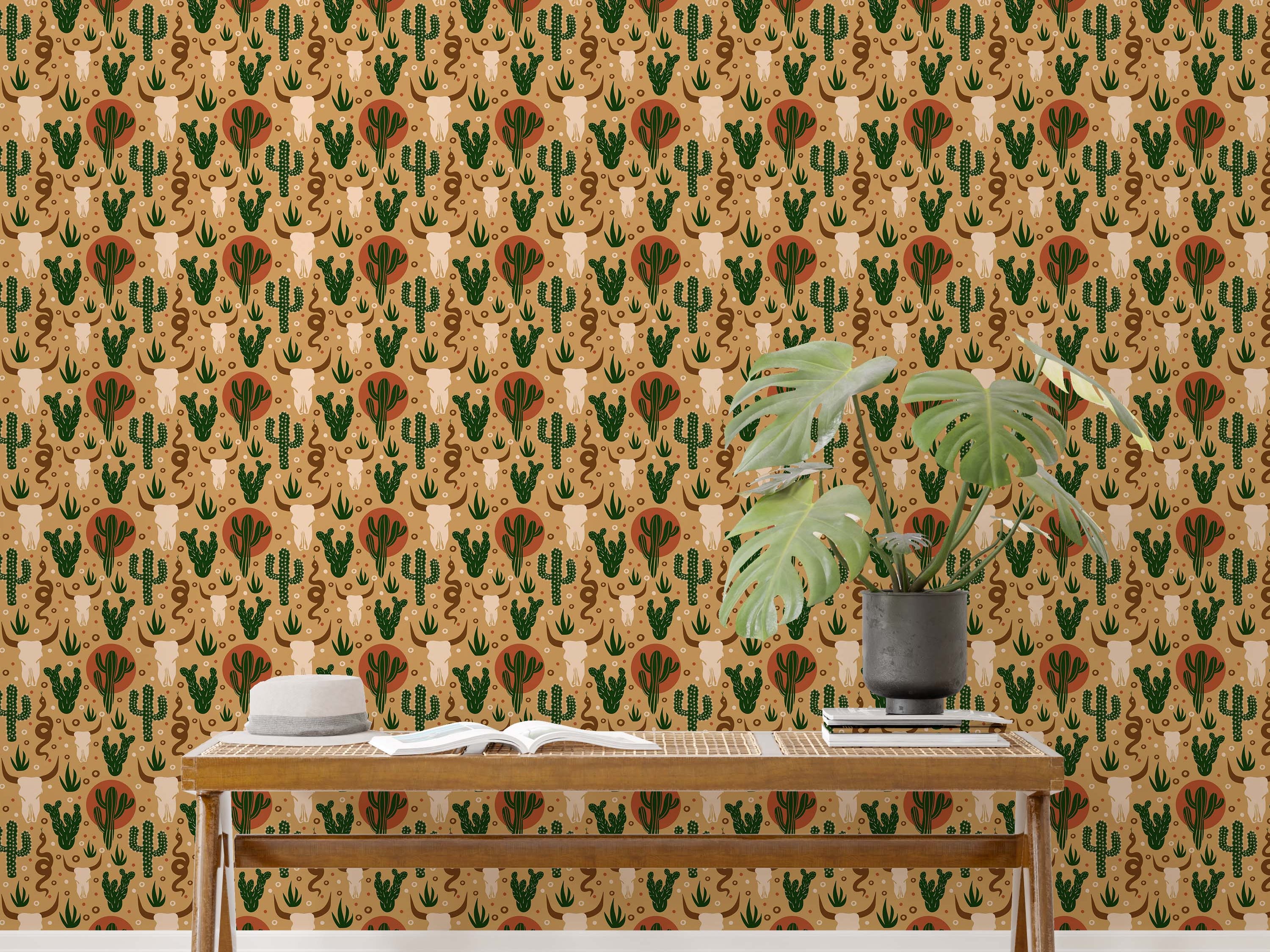 Southwestern wallpaper with illustrated cow skulls, green cacti, terracotta suns, and snakes on a tan background.