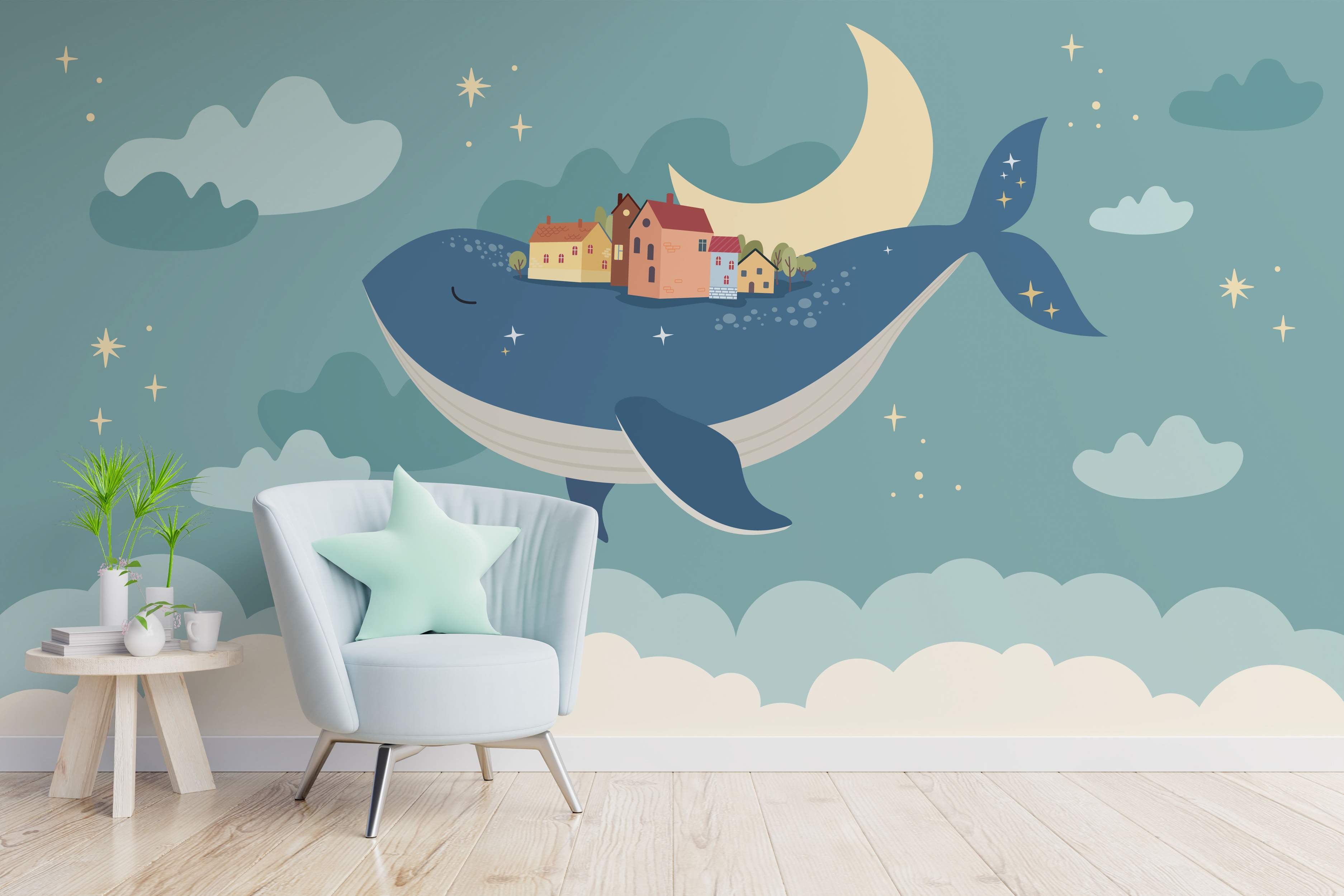Whimsical mural featuring a large blue whale carrying a small village on its back, swimming past a crescent moon and stars in a blue sky.