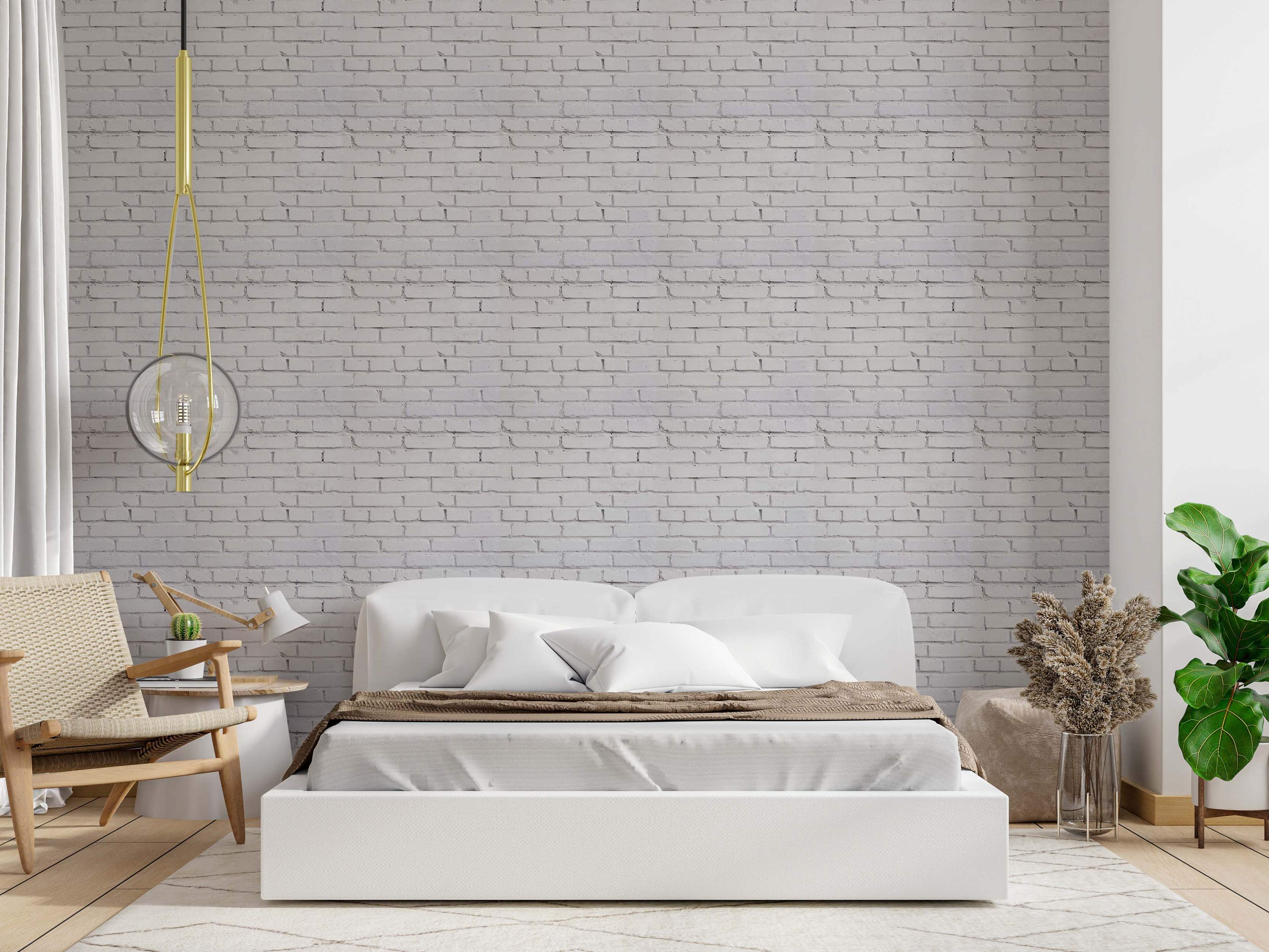 White painted brick wallpaper with subtle gray grout lines and texture.