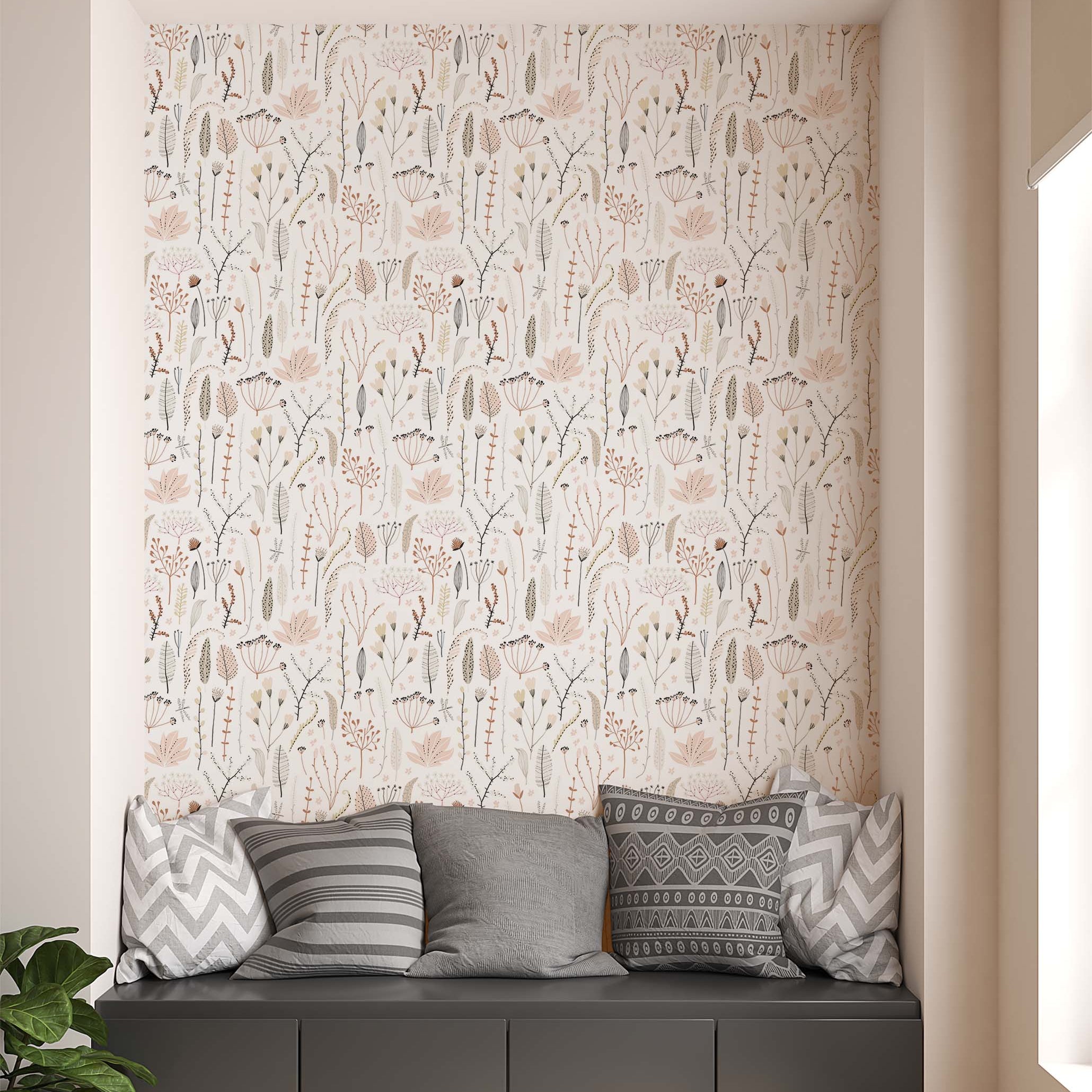 Wallpaper with a delicate pattern of stylized wildflowers and foliage in blush pink, brown, and beige on a light cream background.