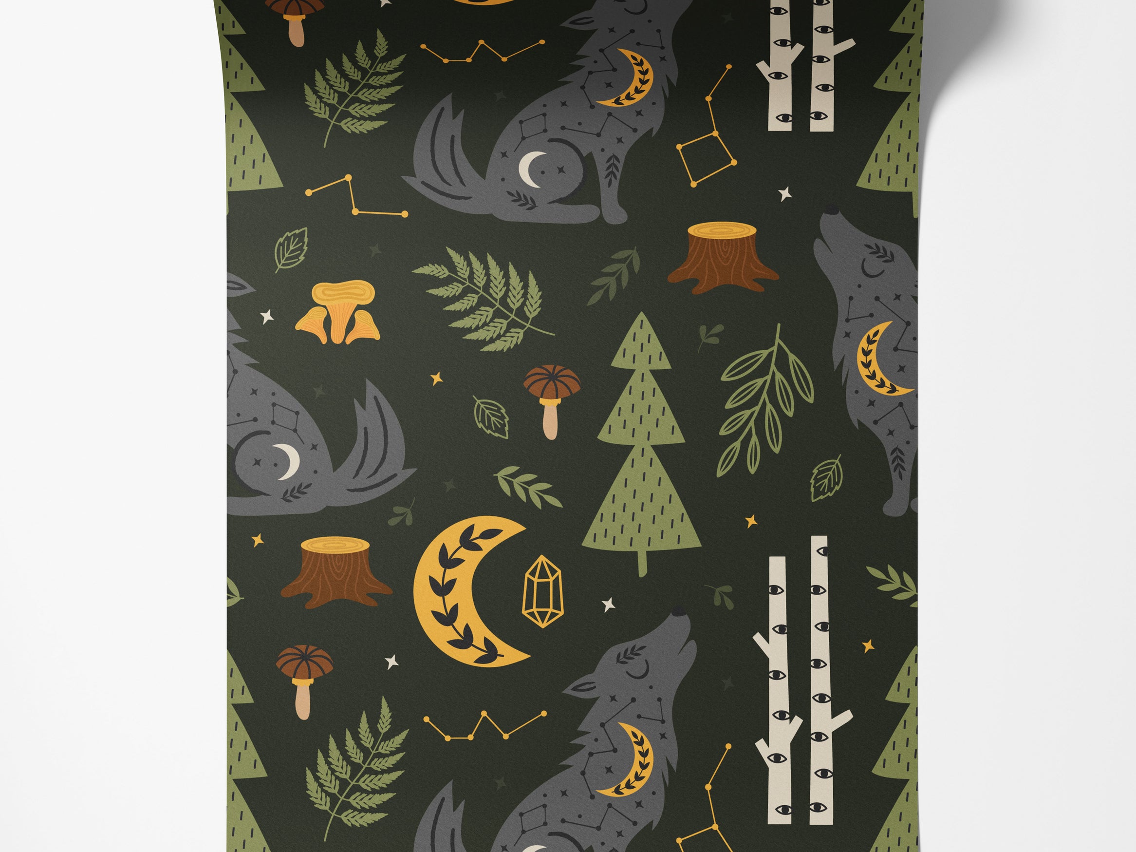 Mystical woodland wallpaper with a pattern of celestial gray wolves, yellow moons, stars, and forest foliage on a dark green background.