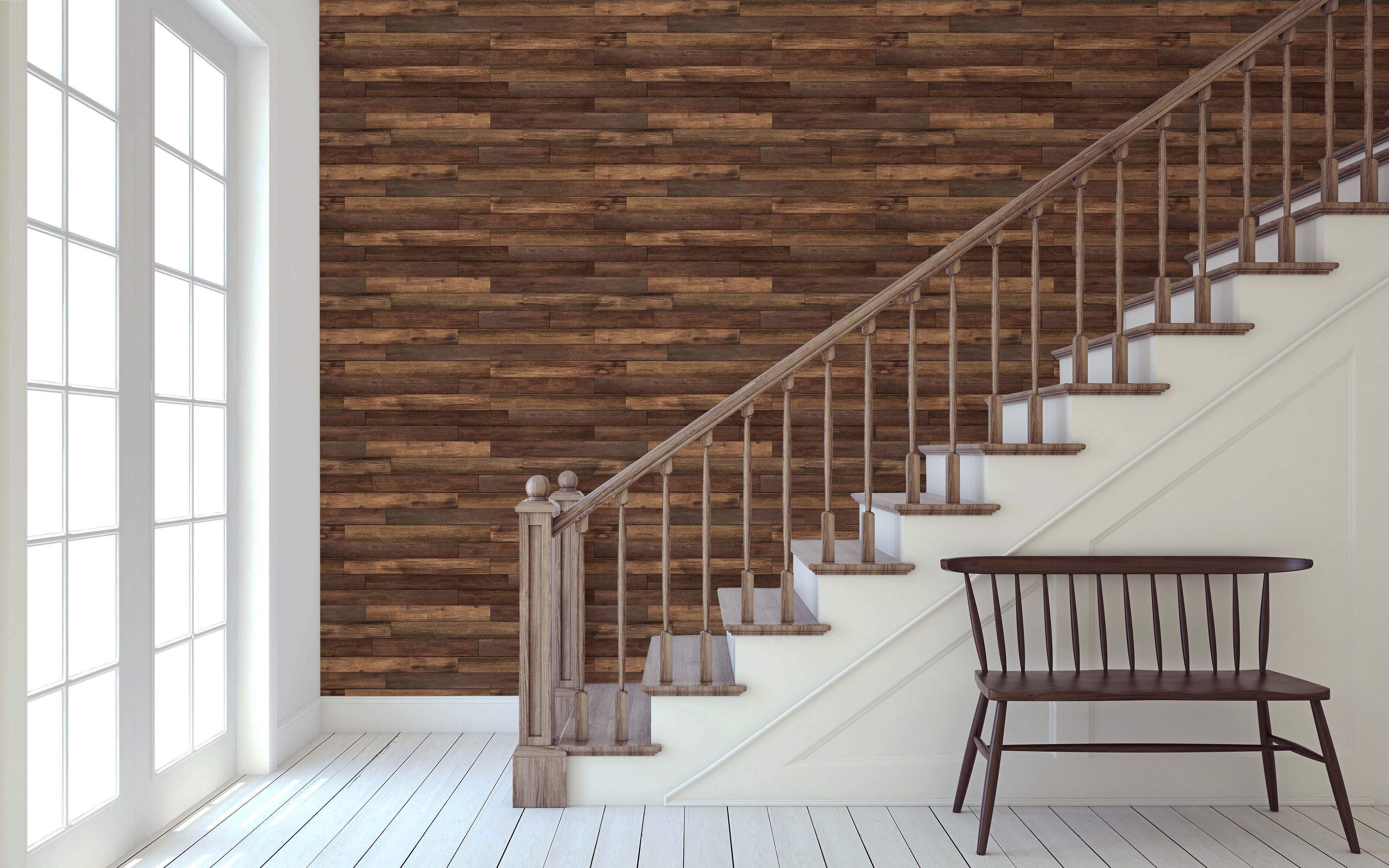 Wallpaper featuring realistic horizontal wooden planks in varied shades of brown for a textured effect.