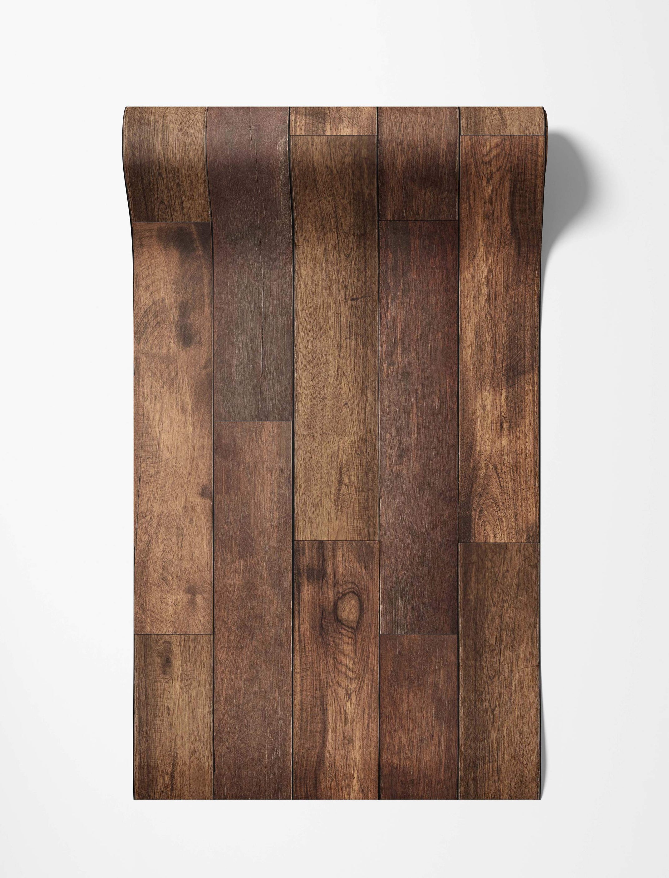 Wallpaper roll displaying a realistic pattern of varied dark brown vertical wood planks with visible grain and knots.